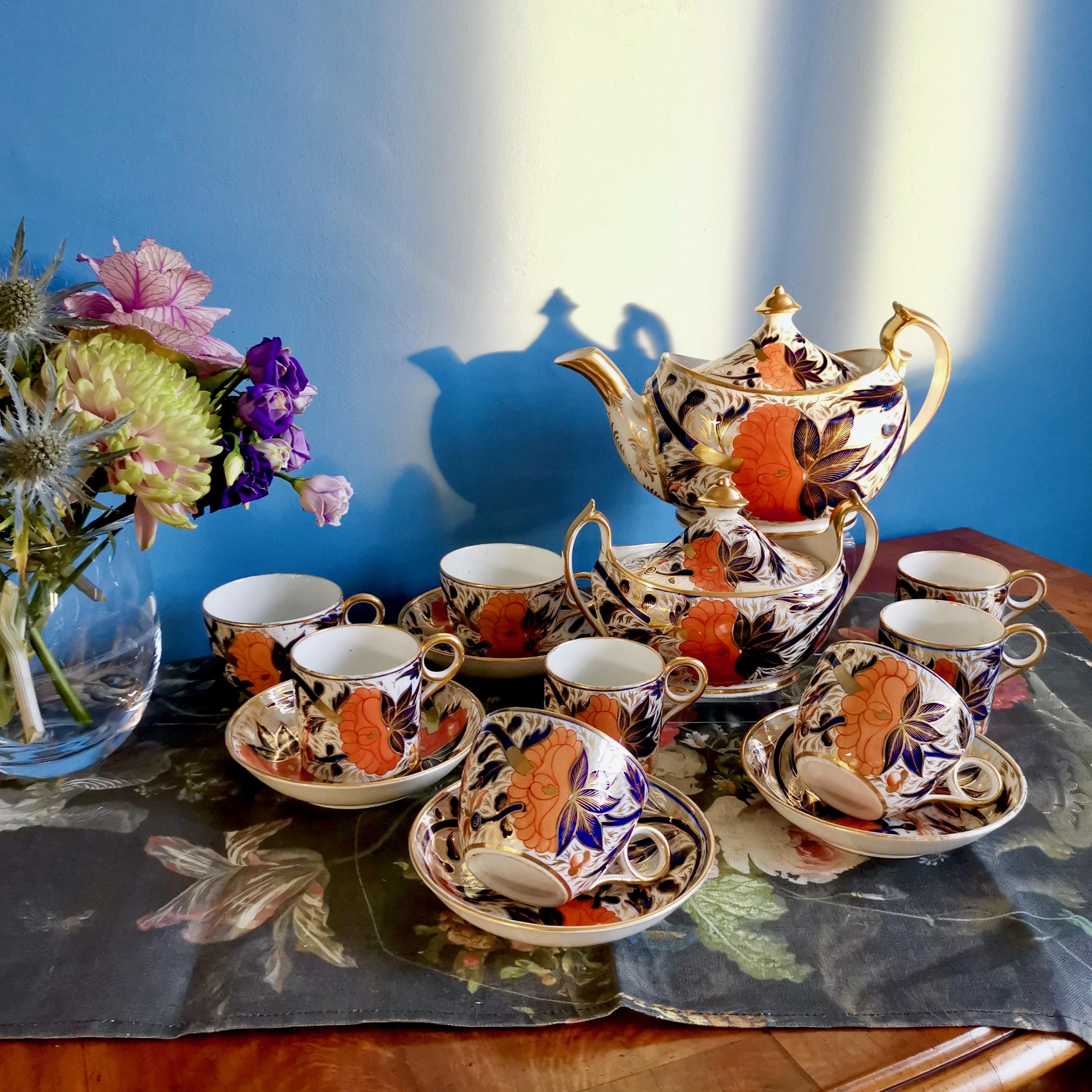 This is a beautiful tea service made by Grainger in Worcester around the year 1810. The service is decorated in a bright Imari pattern and consists of a teapot with cover, a sucrier with cover, and four trios each consisting of a teacup, a coffee