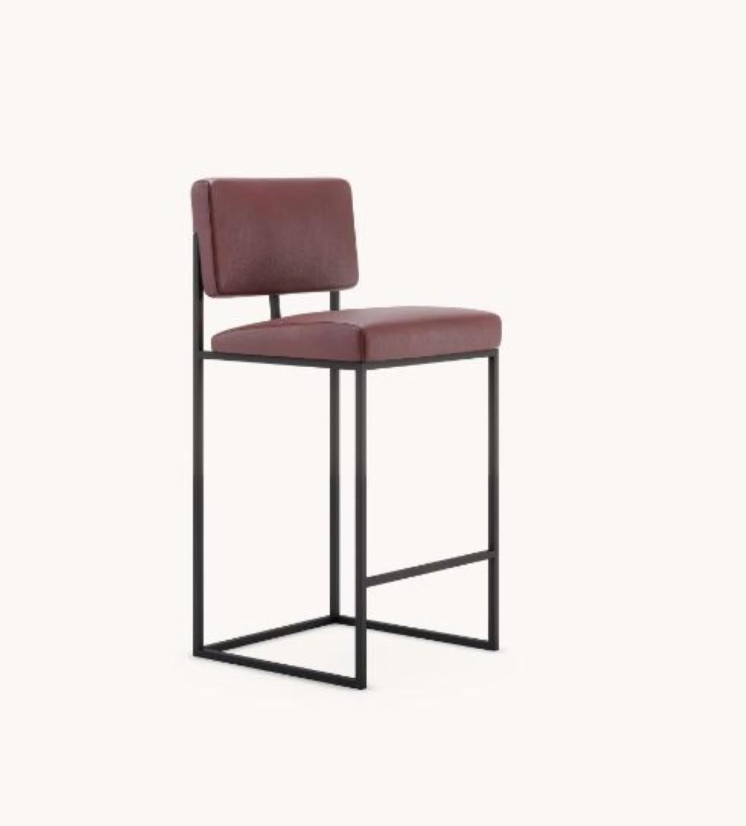Gram counter chair by Domkapa
Materials: Natural Leather, Black Texturized Steel. 
Dimensions: W 44 x D 45 x H 109 cm. 
Also available in different materials. 

Gram’s geometrical and unexpected shapes are the perfect eye-catching option for