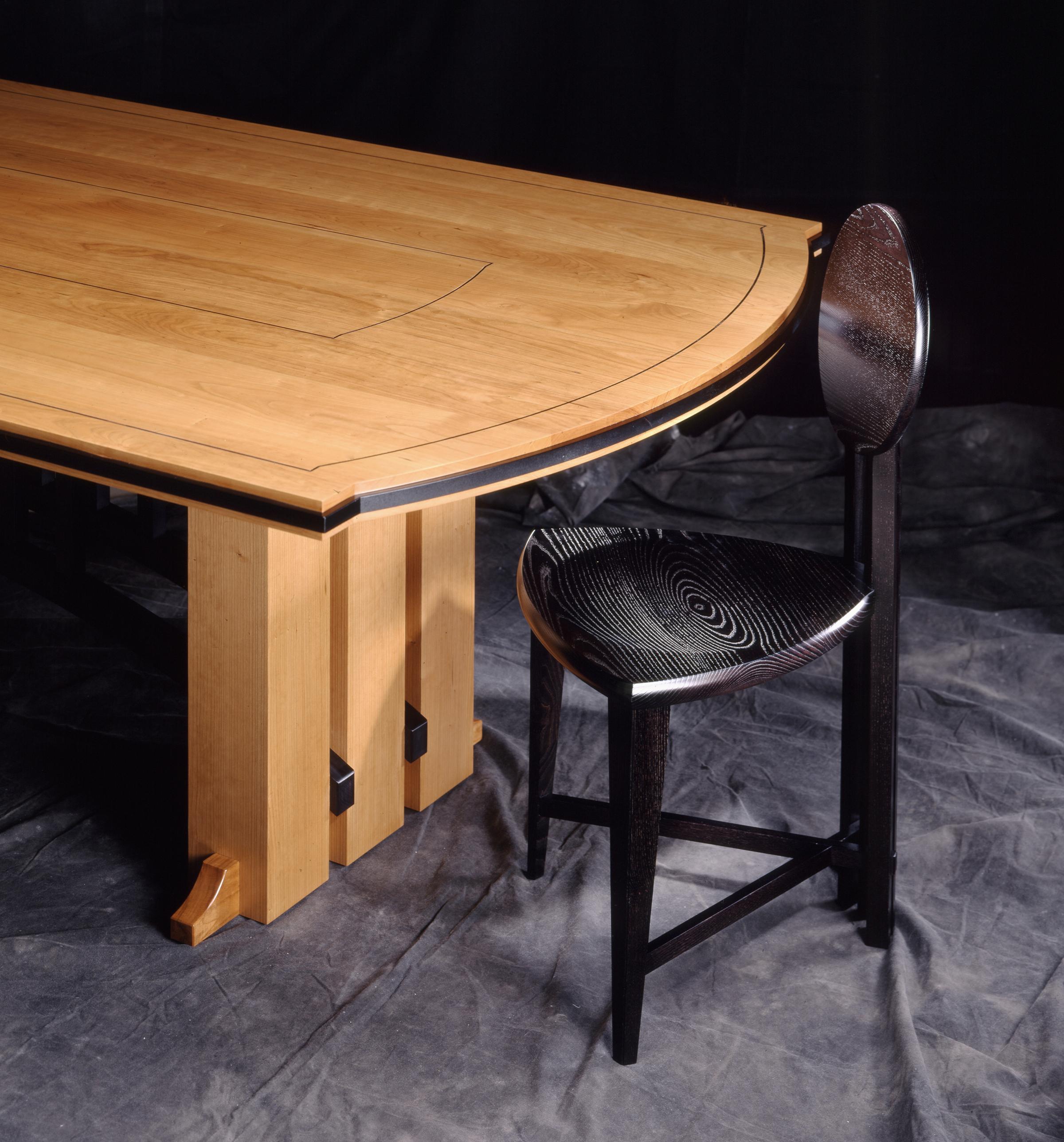 Named after the famous Gramercy Tavern Restaurant in NYC, a table like this resides in the private dining room at the restaurant. The design of this table or desk is well suited in large scale with rectangular, racetrack and boat-shape tops