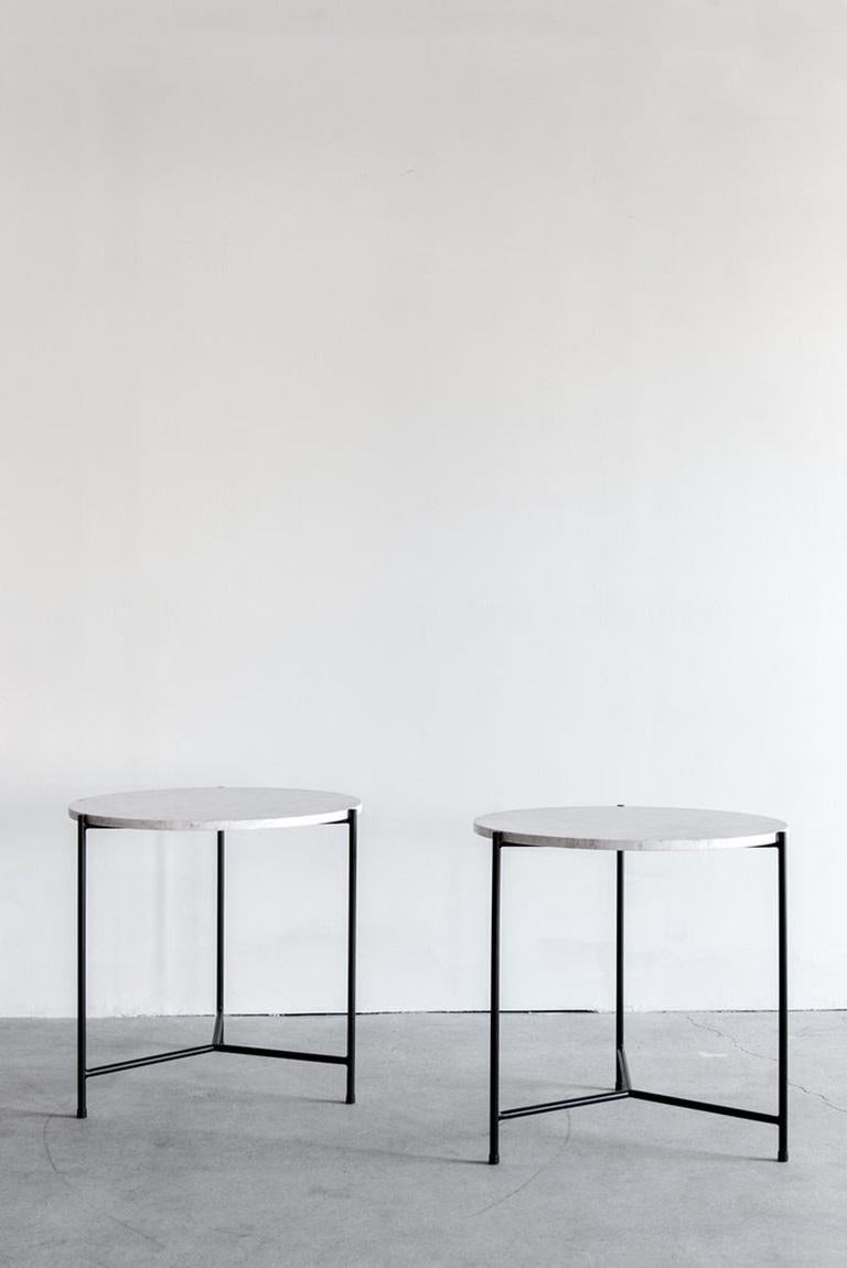 The Granada Side Table is a sophisticated accent piece that balances minimalism with natural beauty. Its round Carrara marble top features natural veining that is emphasized by the understated matte black base made of round stock steel.

Fissures,