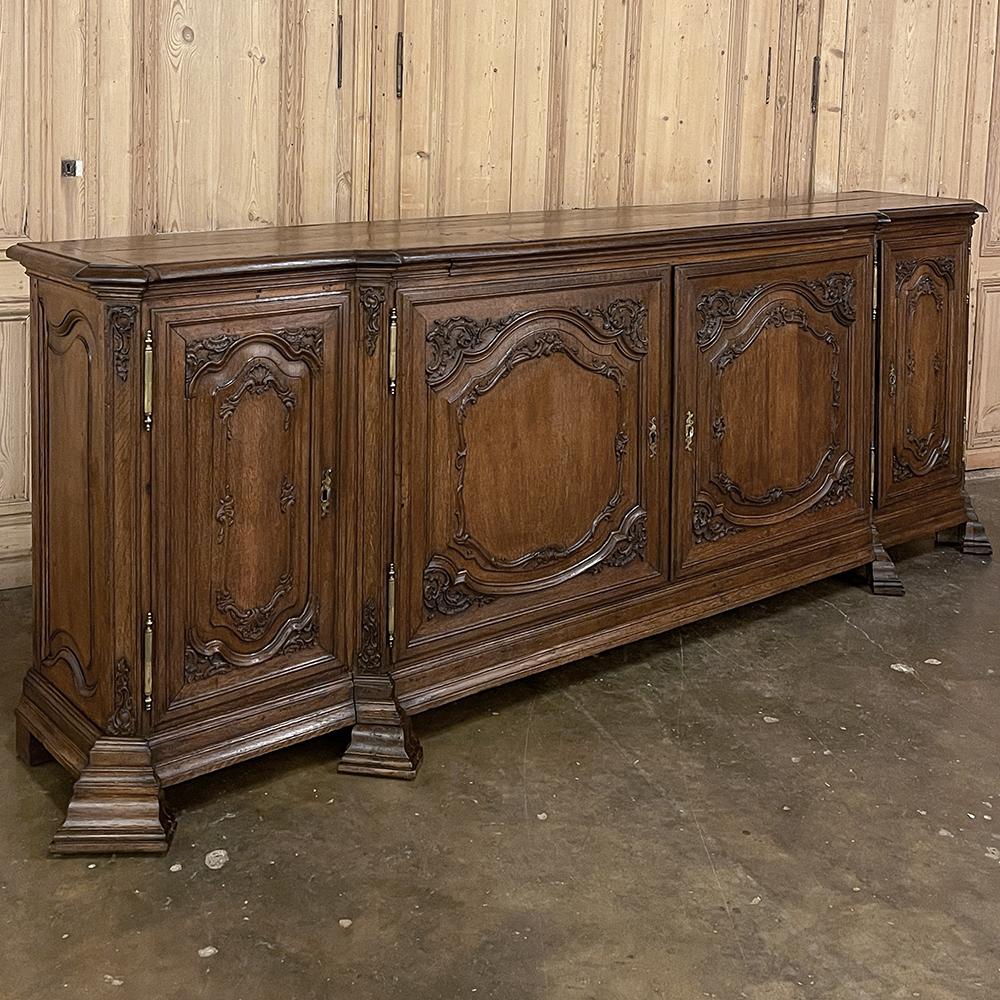 Grand 18th Century French Louis XIV step-front buffet was hand-crafted for a spacious chateau with a large family, and although the tape measure indicates its maximum depth at the center, with the sides recessed it makes a surprisingly small