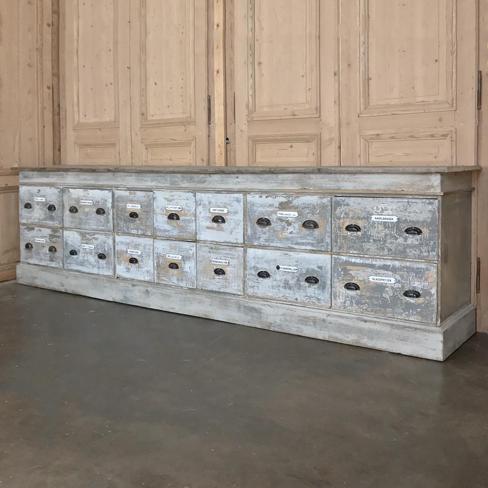 Grand 19th century Apothecary store counter was salvaged from what today would be a pharmacy. Handcrafted on a custom basis to fit each establishment, such counters were specifically designed to meet the requirements of keeping multiple substances