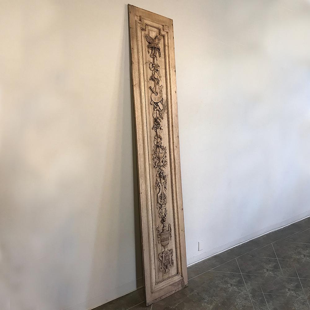 This grand 19th century French Louis XVI hand-carved oak panel is over nine feet tall! Makes is a great choice for dramatic adding a touch of style to any narrow space! Hand-sculpted from one solid plank of oak, it features classical motifs