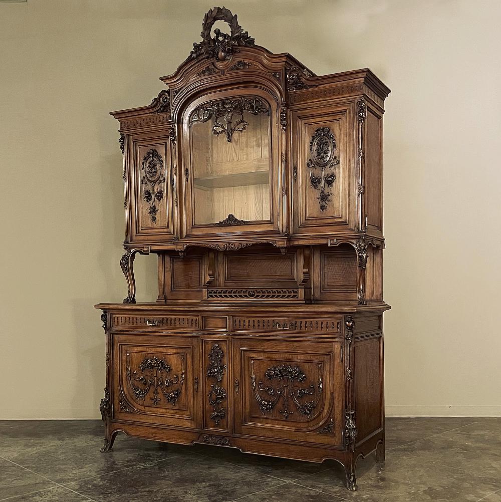 Grand 19th century French Louis XVI walnut China buffet is a stunning testament to the majesty of masterworks of the cabinetmaker's art that emanated from France during the period! Meticulously hand-carved and crafted from select, sumptuous French