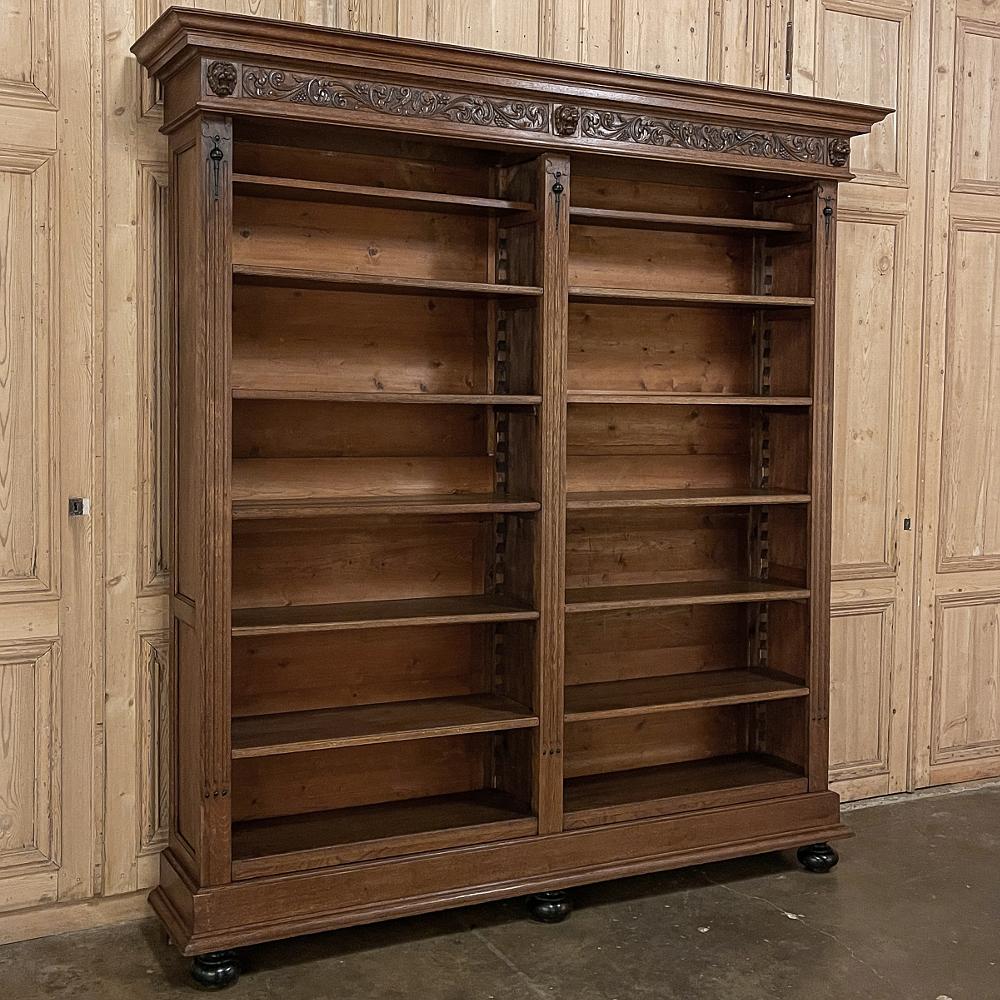 Grand 19th Century French Renaissance open bookcase is a majestic reminder of a bygone era, when displaying one's book collection was a sign of refinement and wealth! This example was rendered from solid old-growth oak, and fitted with