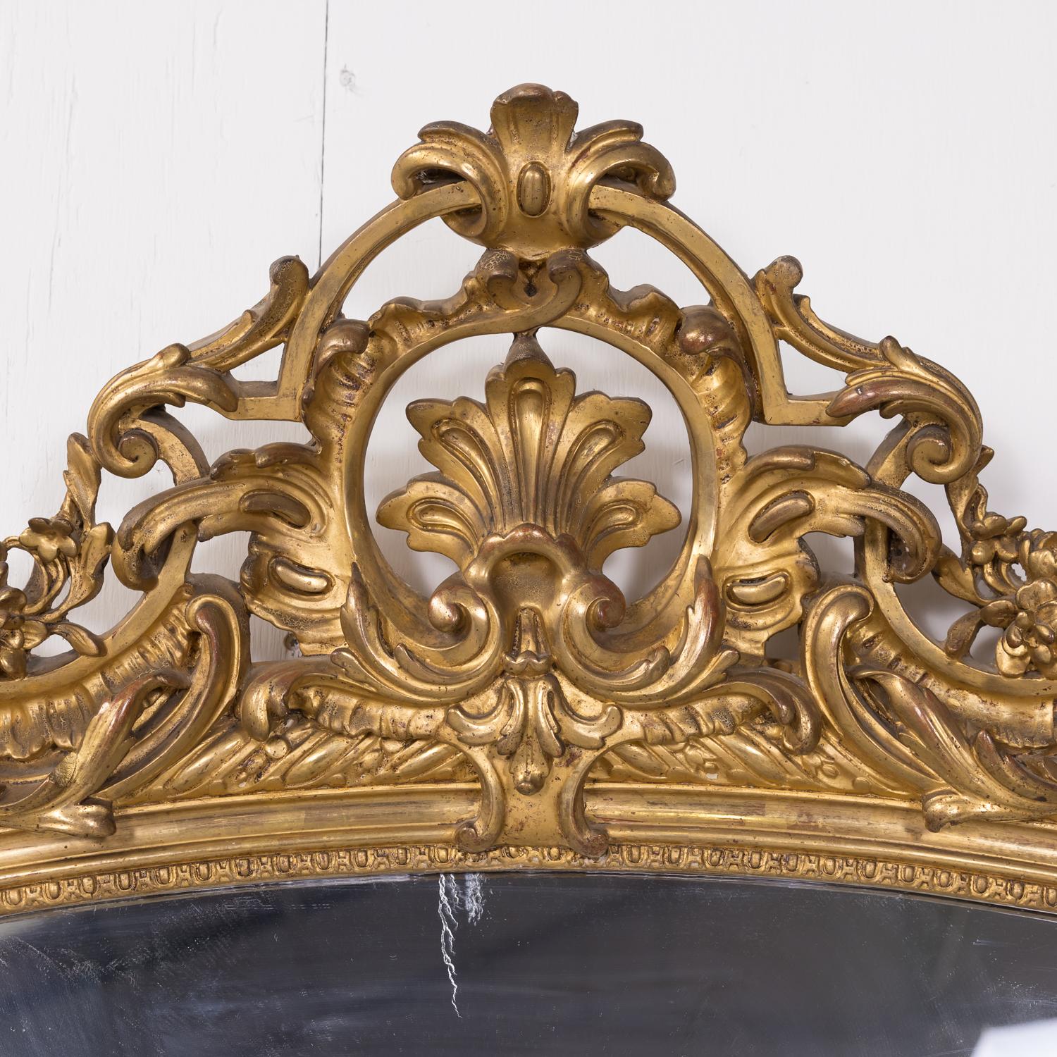 Grand 19th Century Heavily Carved French Louis XV Style Rococo Giltwood Mirror In Good Condition In Birmingham, AL