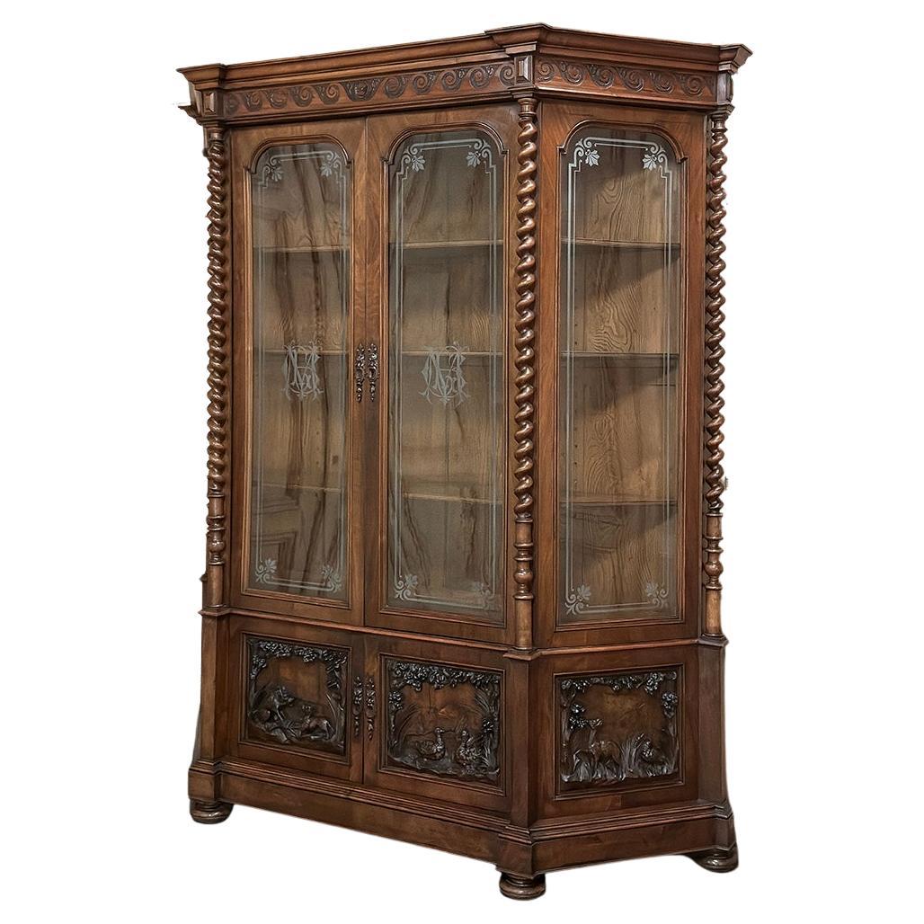 Grand 19th Century Italian Renaissance Walnut Bookcase is a magnificent example of master Italian craftsmanship, crafted on a grand scale for a grand home!  Featuring a trapezoidal shape which allows light in from all sides to further allow