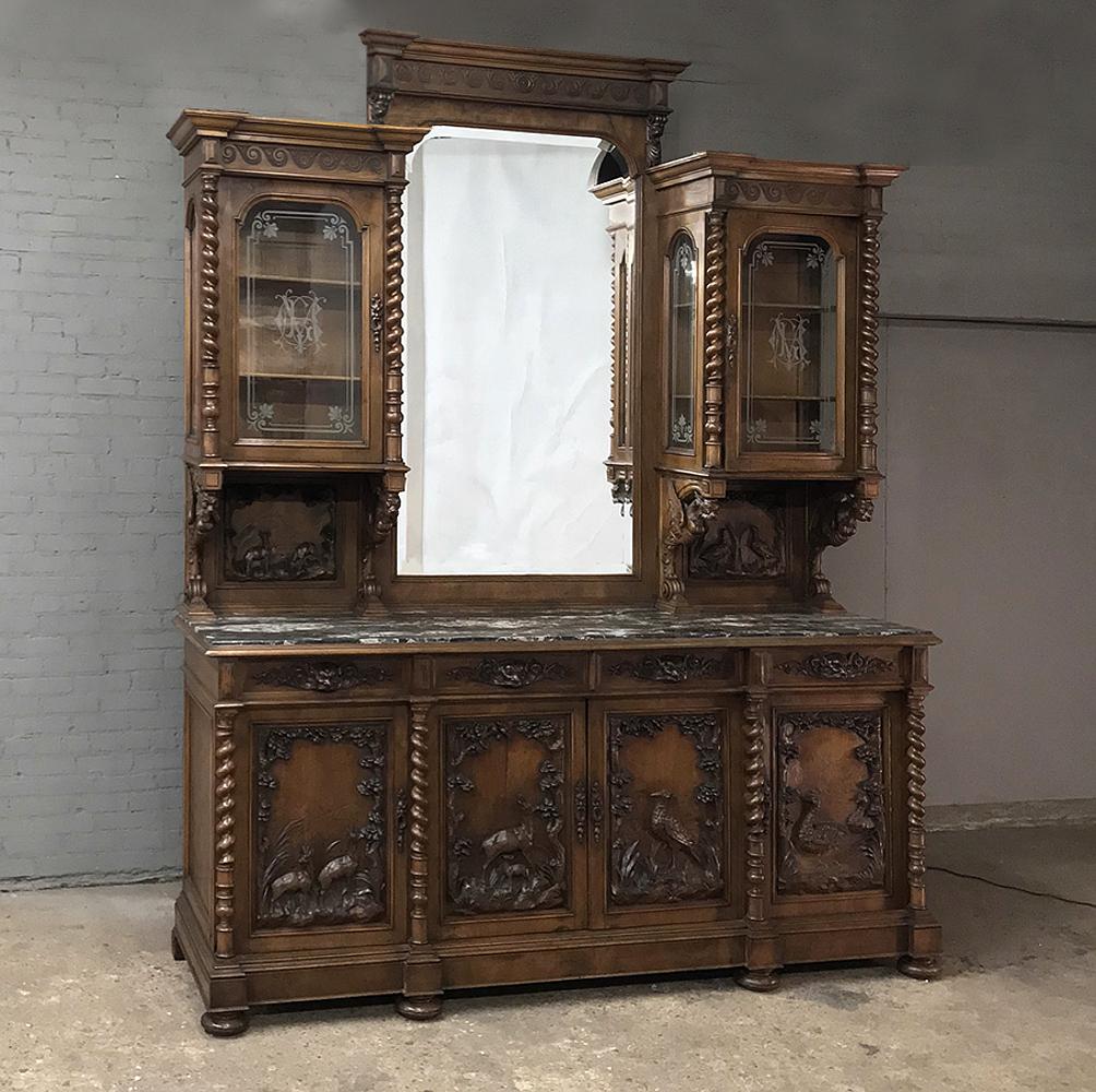 Grand 19th century Italian Renaissance walnut marble top two-tiered hunt display buffet soars over nine and a half feet high! Hand-sculpted from select Italian walnut by master artisans, it features a triple crown above, with two upper display