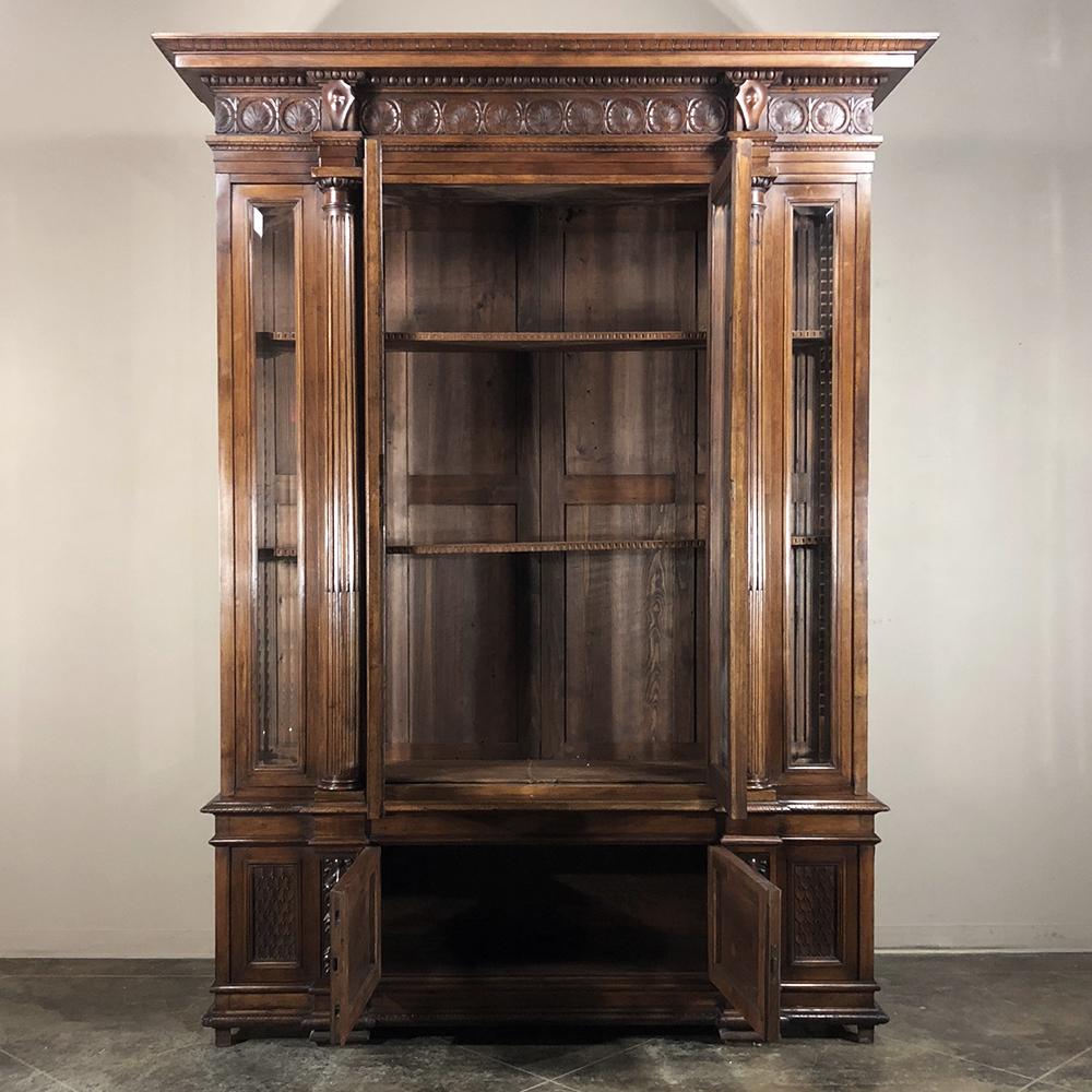 Hand-Carved Grand 19th Century Italian Walnut Renaissance Bookcase with Hunt Wildlife Scenes For Sale