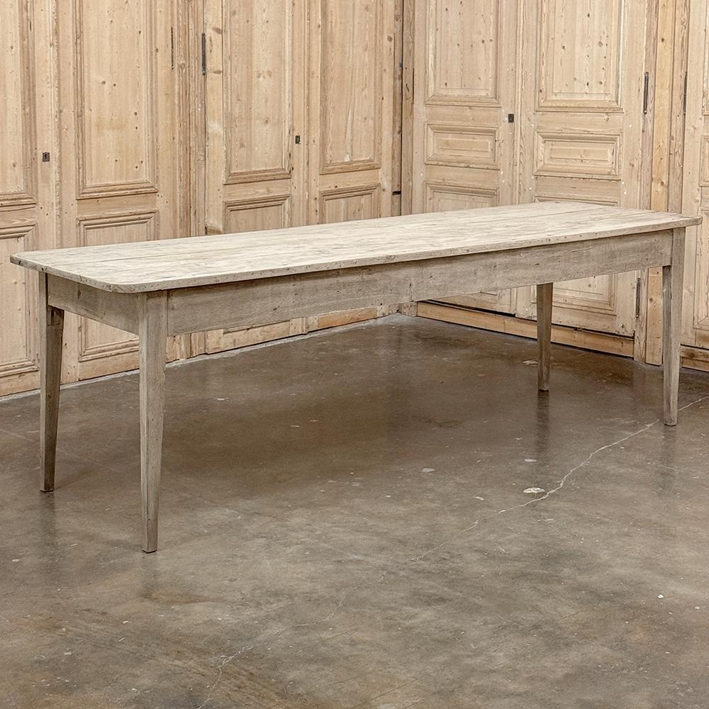 Grand 19th Century Rustic French Elm Farm Table is a lasting testament to the rural craftsman, who utilized indigenous materials to create sturdy furniture to last for generations.  Mortise & tenon joinery are the rule here, with sycamore being used