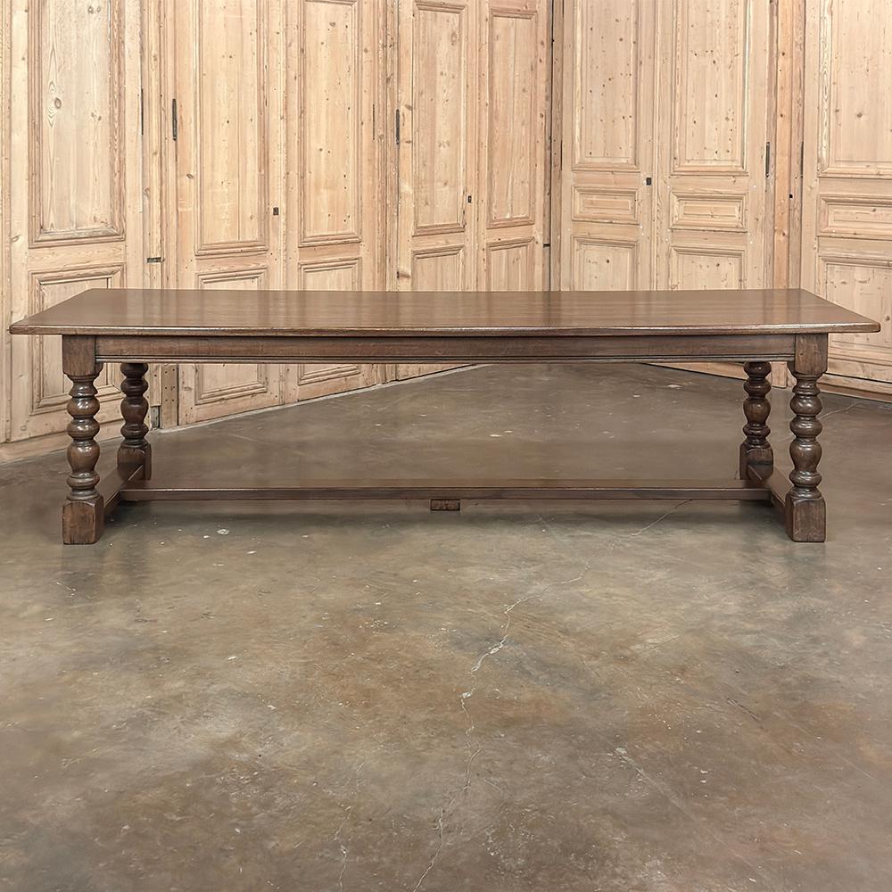 Grand Antique Banquet Table with Two Leaves and Turned Legs is ideal for large families or those who like to entertain!  Stretching nine and a half feet without leaves, it sports two leaves that attach with sturdy oak supports that insert into solid