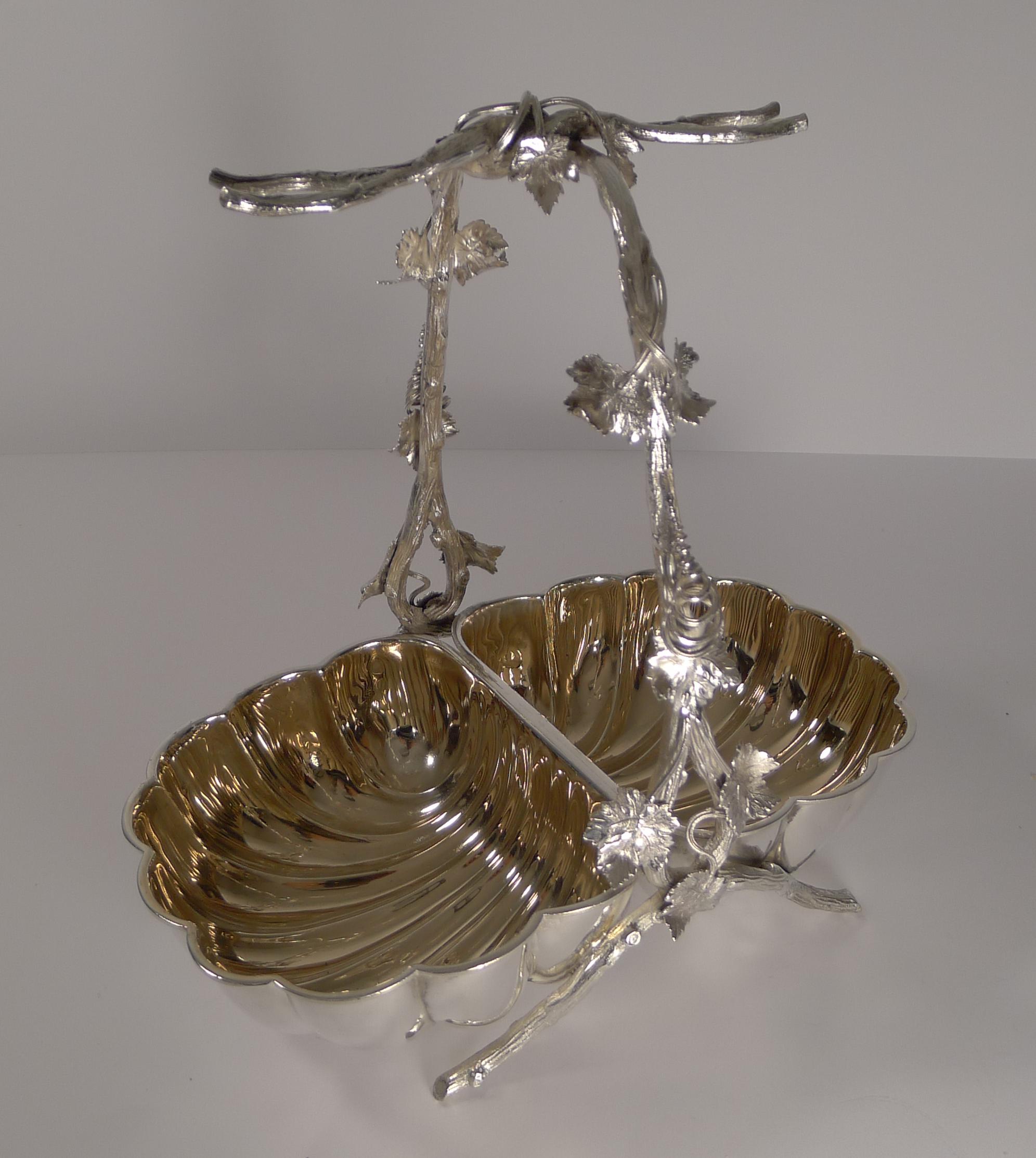About as good as they get, this is a truly special silver plated grape dish with double shell shaped bowls with naturalistic supports decorated with vine leaves.

This dish would create a magnificent show on the sideboard or on the dining table,