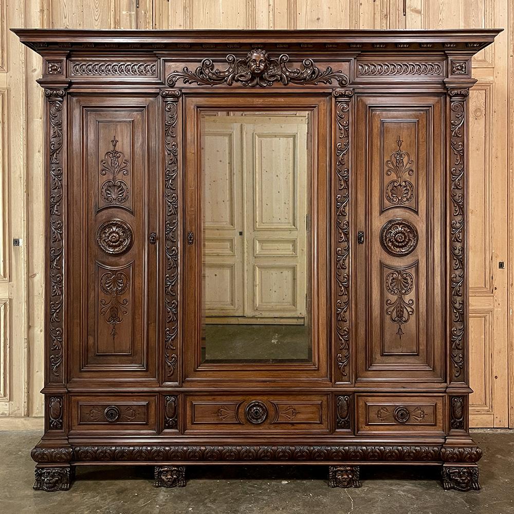 Grand Antique Italian Renaissance Walnut Triple Armoire combines neoclassical architecture inspired by the ancient Greeks and Romans, with hand-carved embellishment inspired by the Renaissance which originated in Italy just after 1500AD. The boldly
