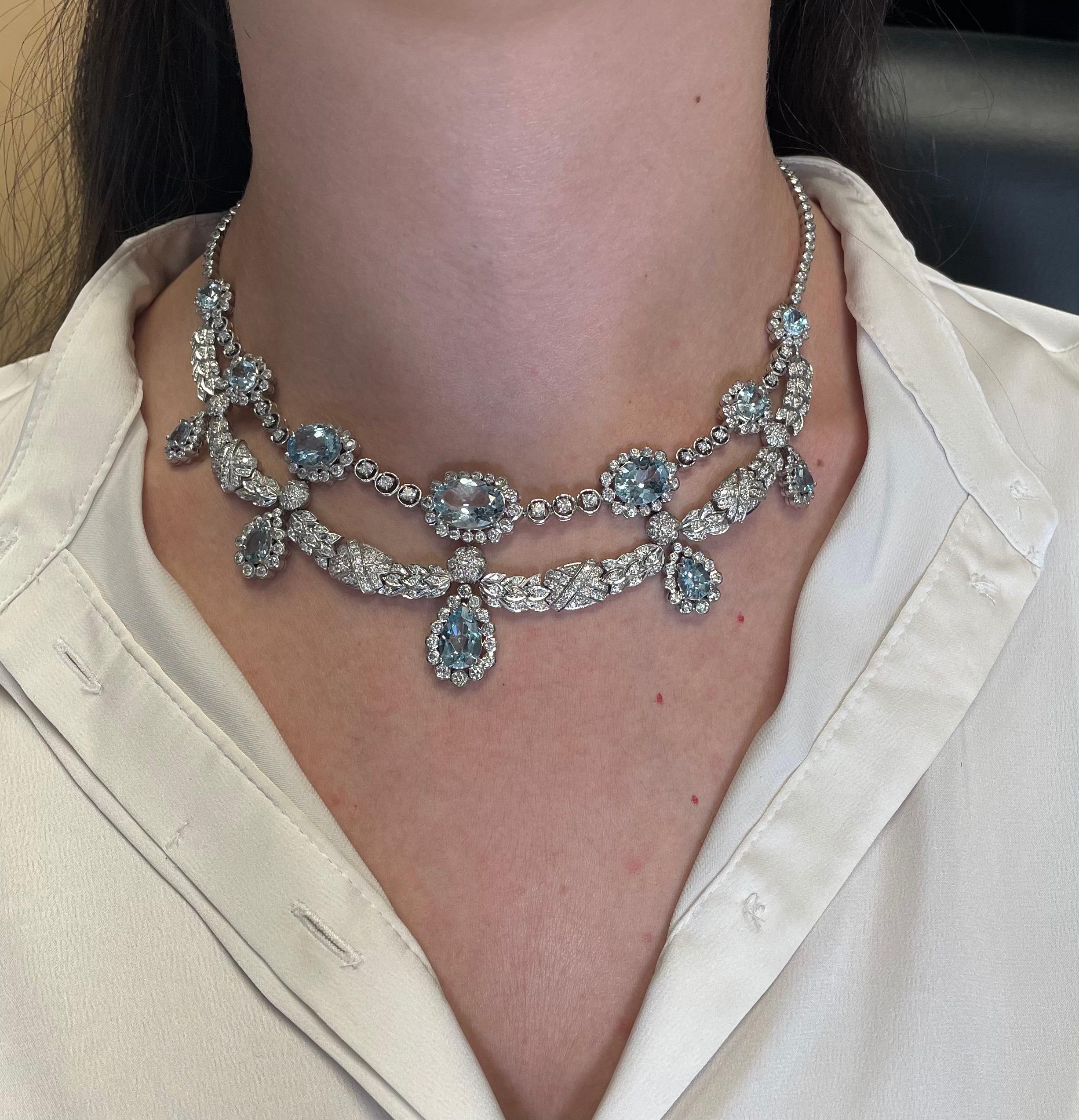 Statement Edwardian inspired aquamarine and diamond necklace.
19.35 carats of oval and pear shape aquamarines beryl. 10.48 carats of round diamonds, approximately H/I color and SI clarity. 18-karat white gold. 
Accommodated with an up to date