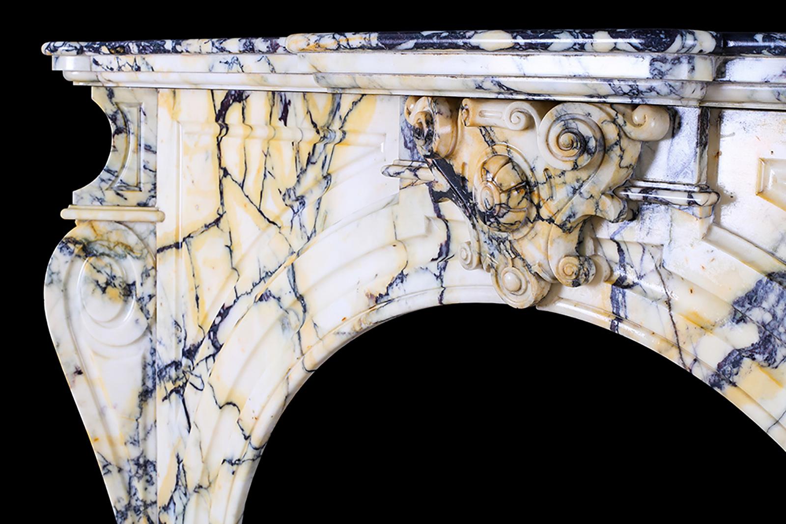 Grand arched pavonazza marble antique chimney piece, Belgian mid-19th century.