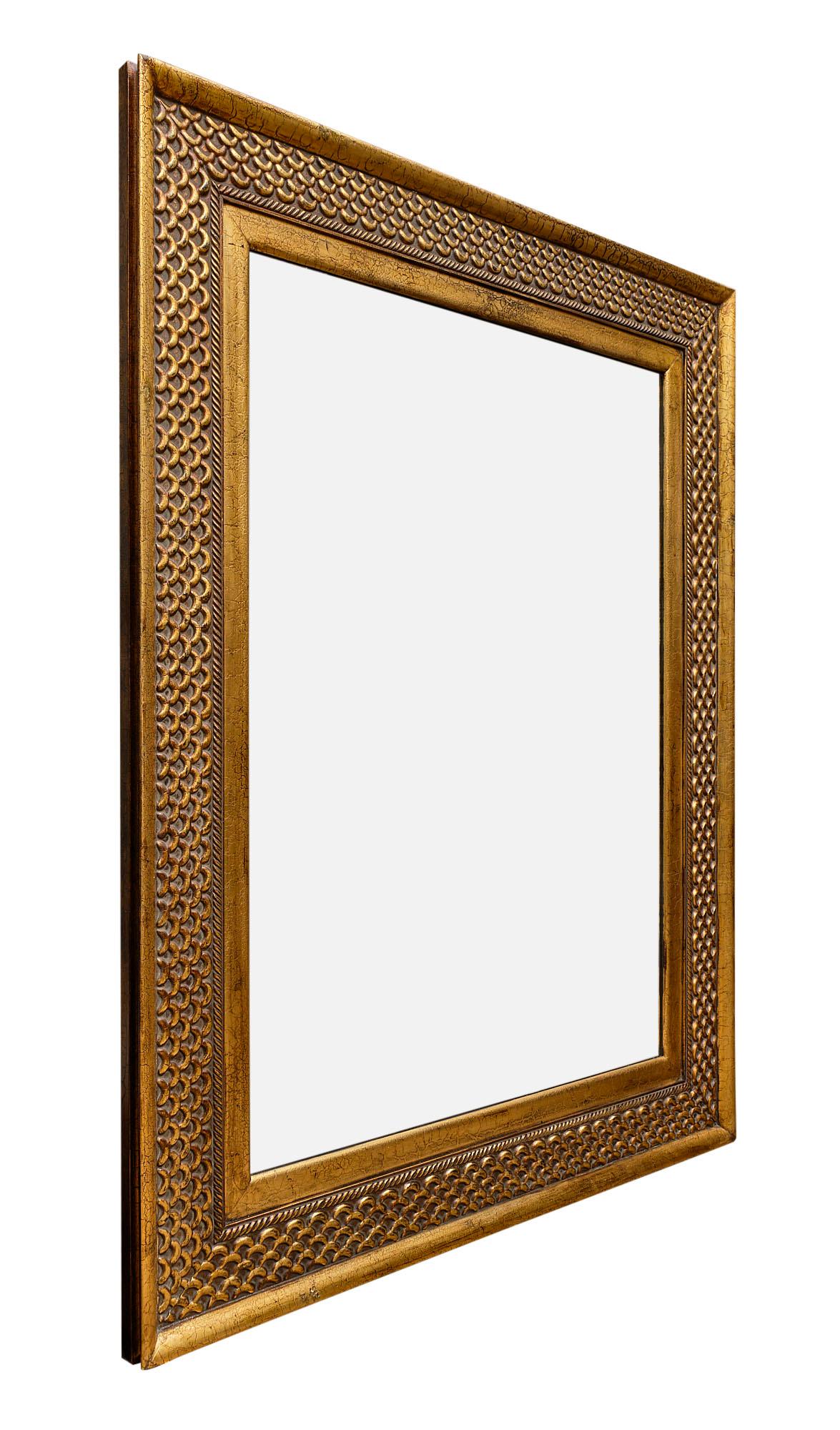 Grand Art Deco style mirror from France made of hand-carved wood with gold leafing. We love the impressive size of this piece!
