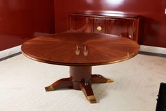 Grande tavolo da pranzo allungabile in mogano in stile Art Déco, opera di Jules Leleu