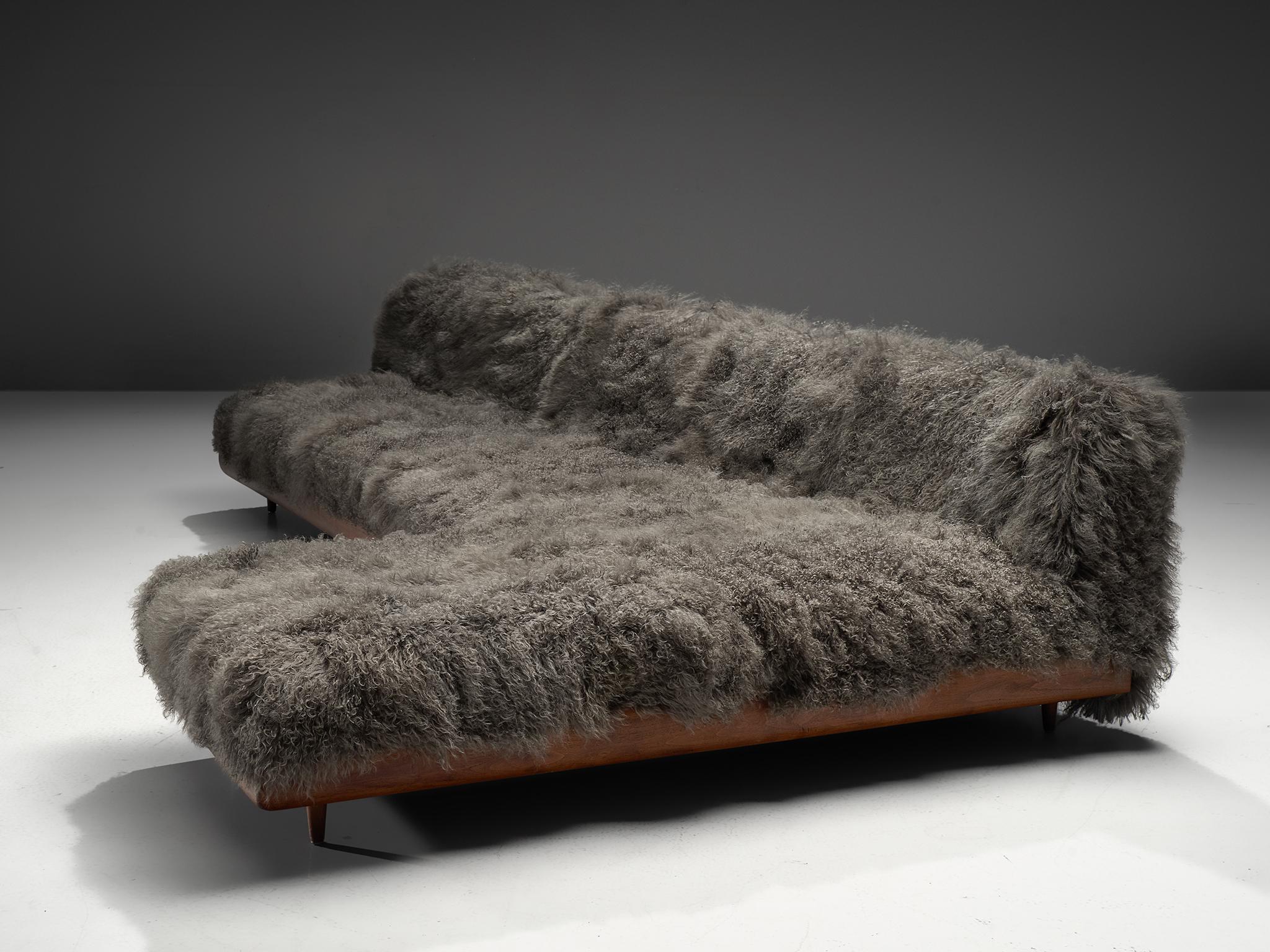 Adrian Pearsall, 'Boomerang' sofa, in grey Tibetan wool and walnut, United States, 1960s

This boomerang sofa has a unique shape with sinuous lines which create a monumental and inviting look. The sofa is a great addition to a living area or