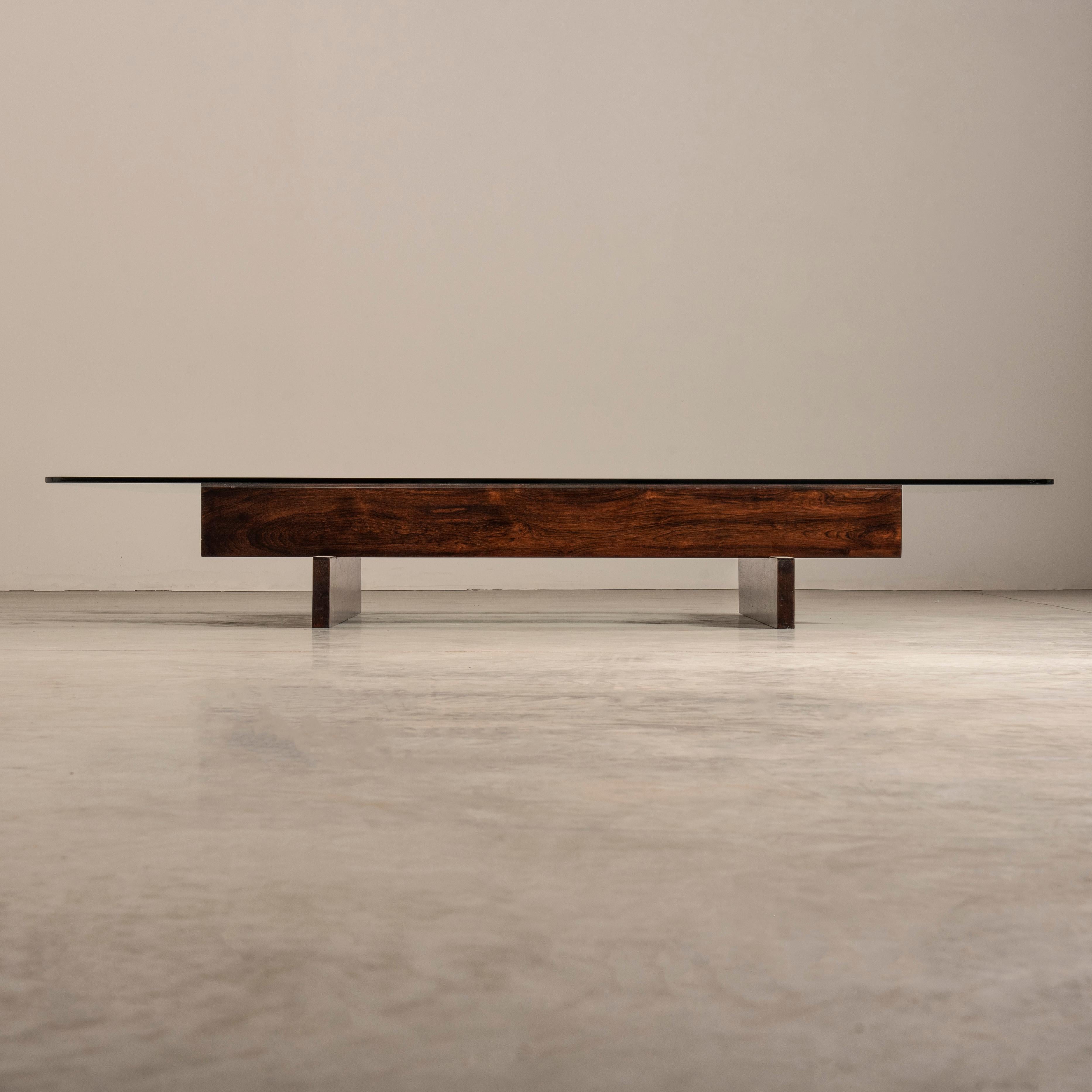 Introducing the coffee table by Celina Decorações, a sophisticated and elegant piece that exudes the typical charm of Brazilian mid-century design. With a wooden structure composed of solid slabs positioned on top of each other, and a rectangular