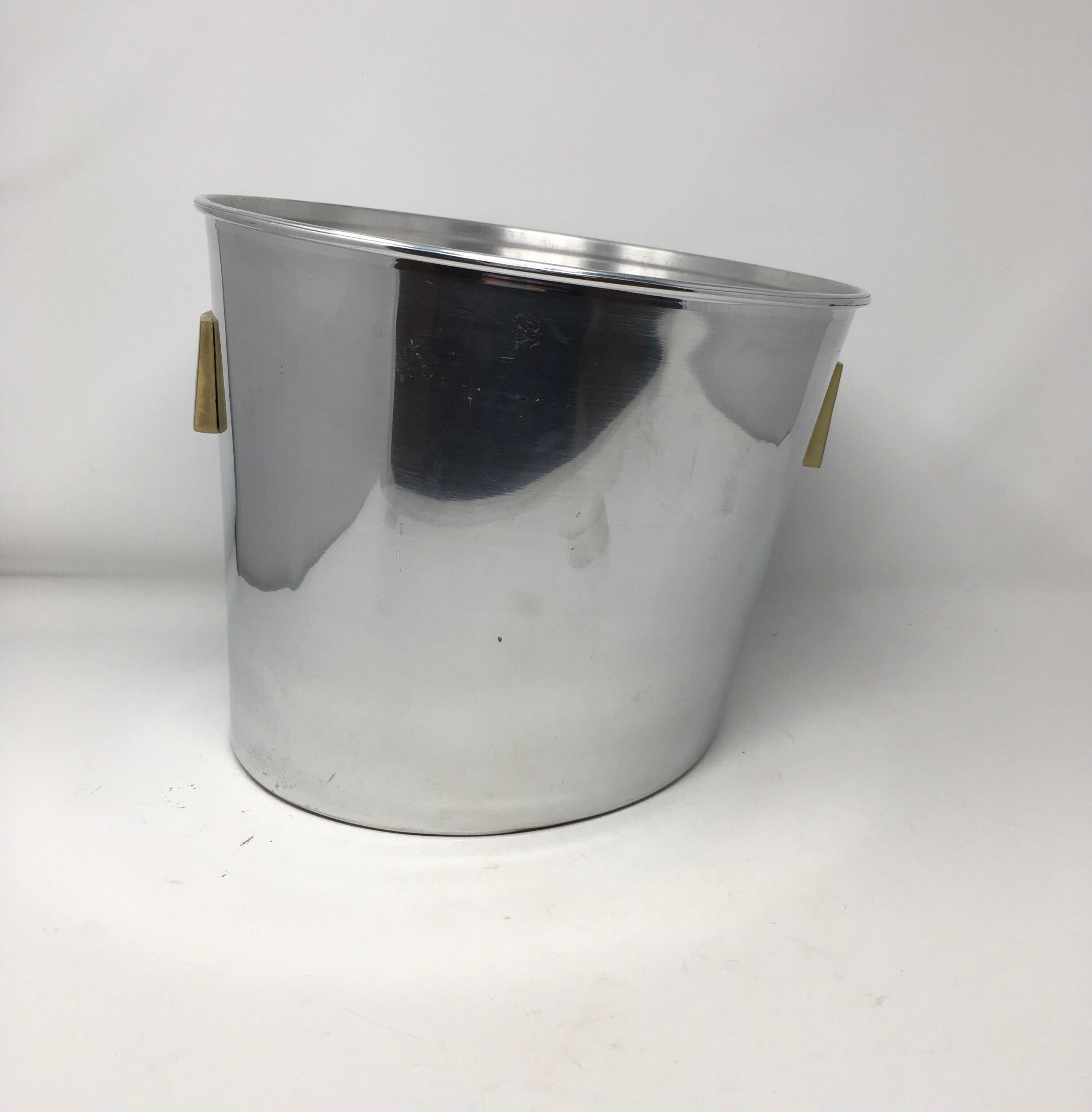 This Grand Deutz champagne bucket holds three standard bottles or a Magnum. The original aluminum cooler, made in France for the famous Deutz champagne grower in AY, has an unusual oblique shape and brass labels on both sides. Would be a beautiful