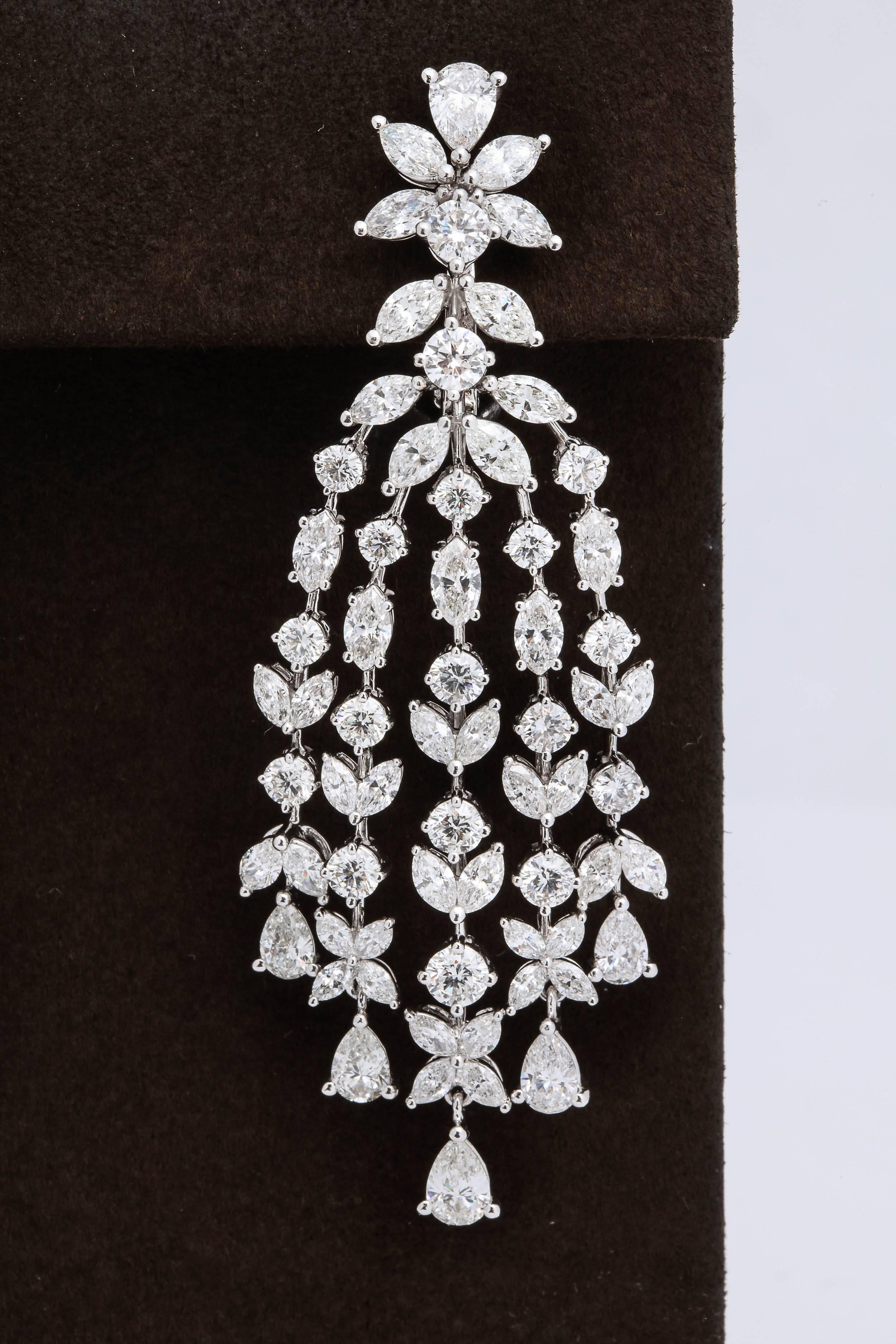 
A beautiful pair of grand earrings.

15.84 carats of white round, pear, and marquise cut diamonds set in 18k white gold. 

A grand design that mimics those found on the red carpet today -- perfect for your next black tie affair!

Approximately 2.55