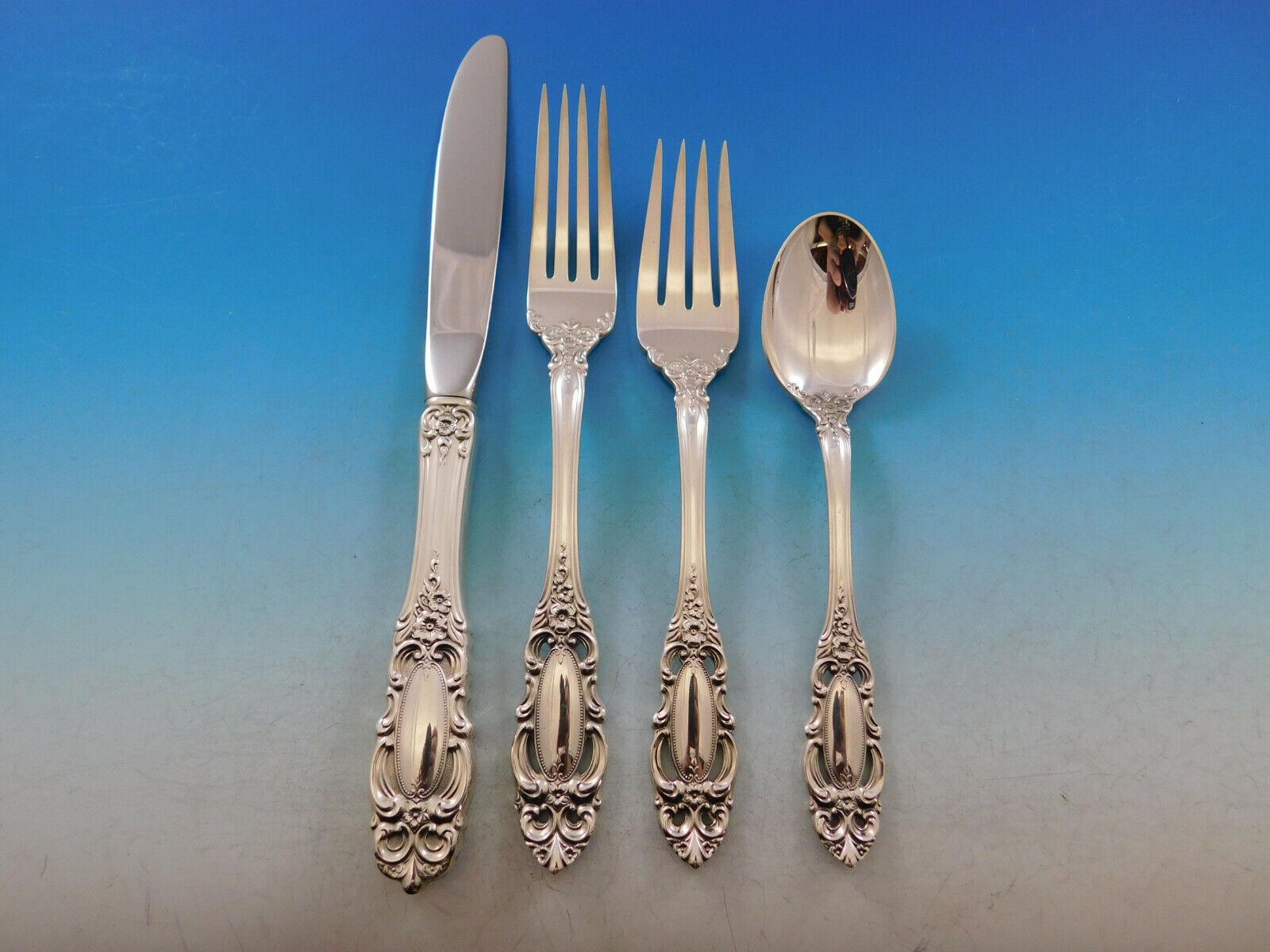 A gently tapered handle leads to a quiet work of rosettes and scrollwork, emphasizing the detail of this pattern. The oval mirror in the center of the handle acknowledges the vanity of ancient royalty, and serves as the focal point of the