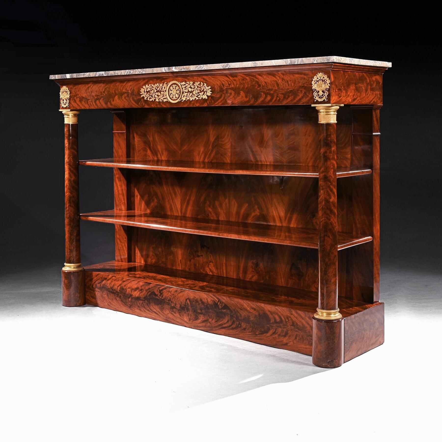 A Very Fine and Extremely Large Mahogany Empire Period Console Dessert With Finely Cast Gilt Bronze Mounts



French Paris Circa 1815-25 



The present piece of furniture is rather hard to describe. It could be described as console table but it is