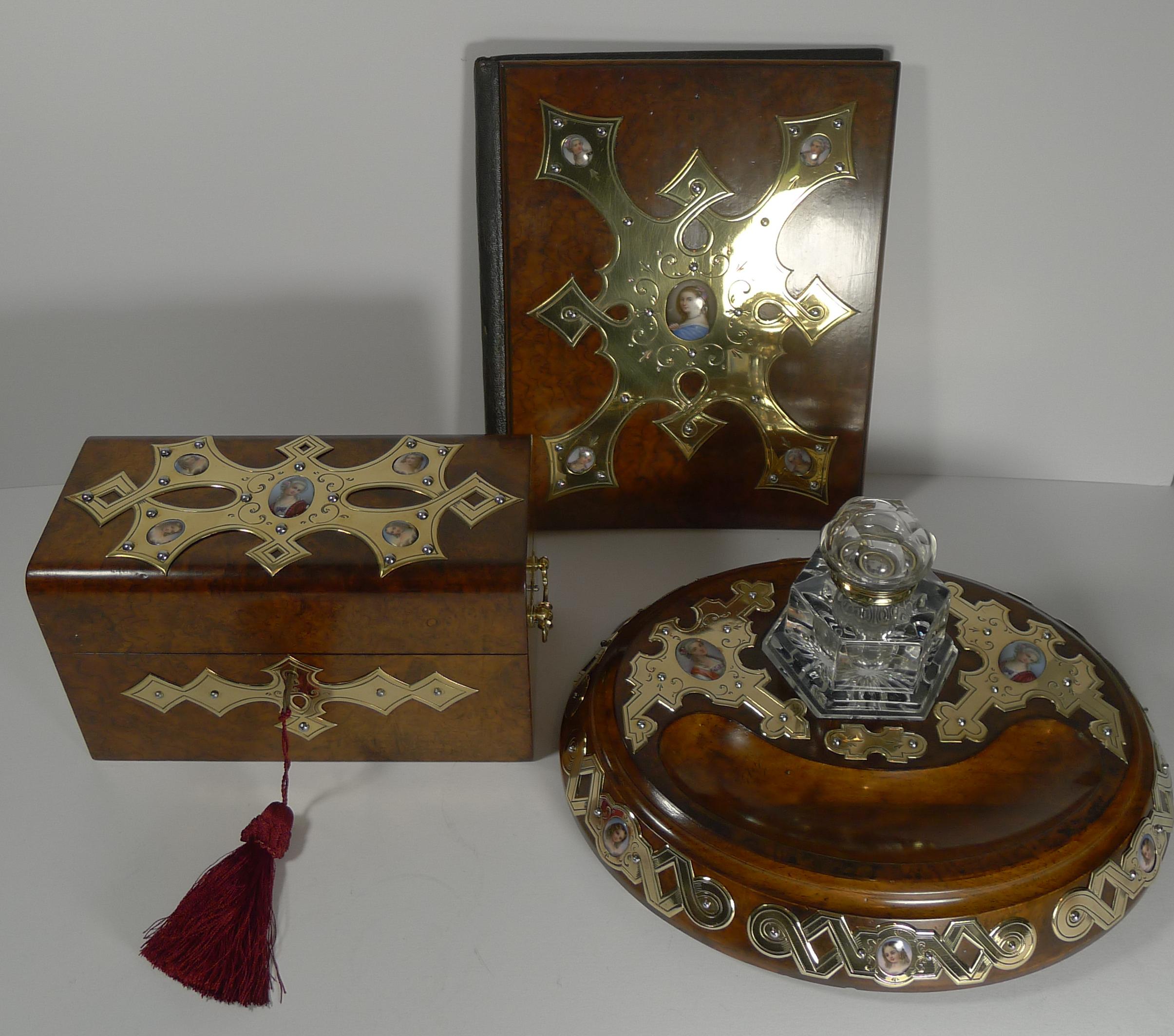 Wonderful to find a top-notch, highly decorative and most unusual desk set, French in origin dating to around 1860. Made from nutty coloured burl Walnut, all three pieces are mounted with the most wonderful polished brass mounts all inset with