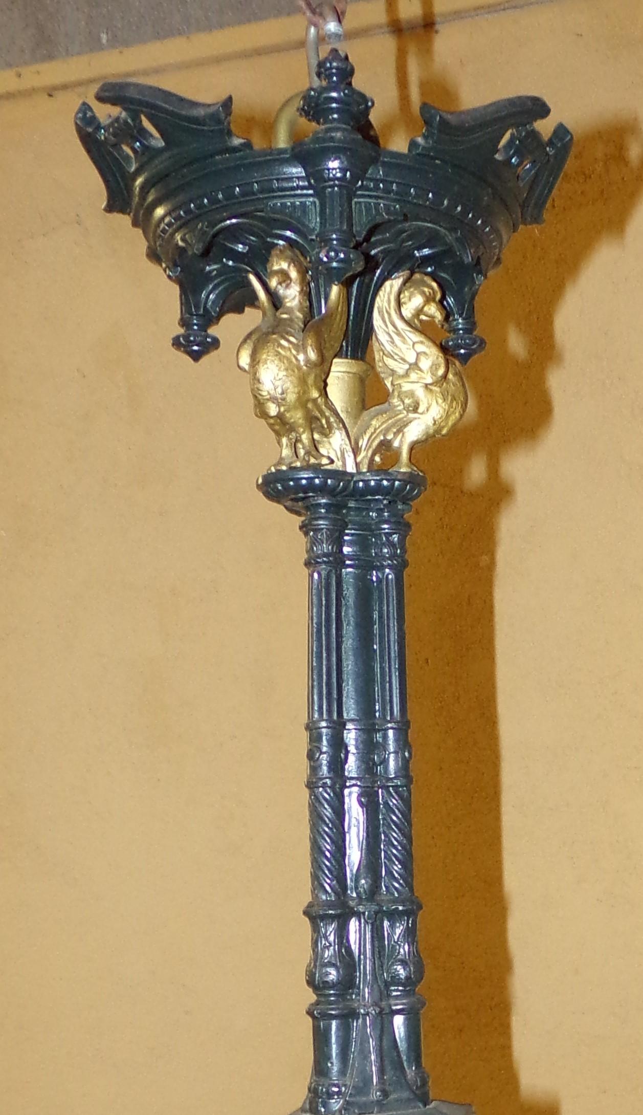 An extremely rare and all original 9 branch Victorian Gothic Revival chandelier in original paintwork and gilding. Made in cast iron and having never been converted to electricity still retaining the candle 