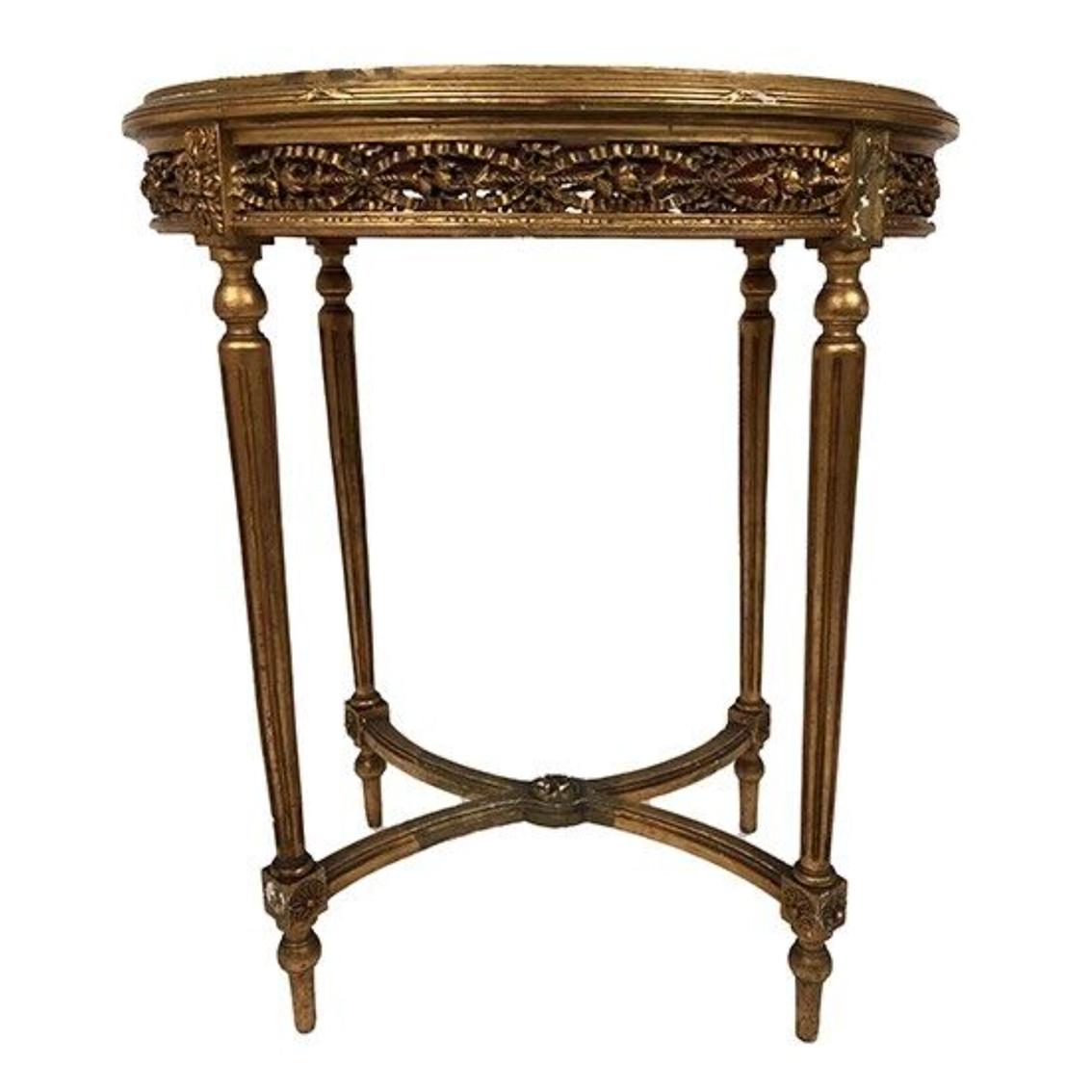 Grand guéridon de style Louis XVI en bois doré et plateau de marbre, fin XIXe
bel état général, belle dorure et très beau marbre
Repose sur quatre pieds fuselés et canelés réunis par une entretoise en X
Ceinture richement sculptée et ciselée
manques