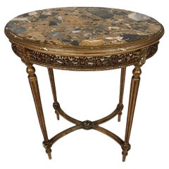 Grand guéridon de style Louis XVI en bois doré et plateau de marbre, fin XIXe