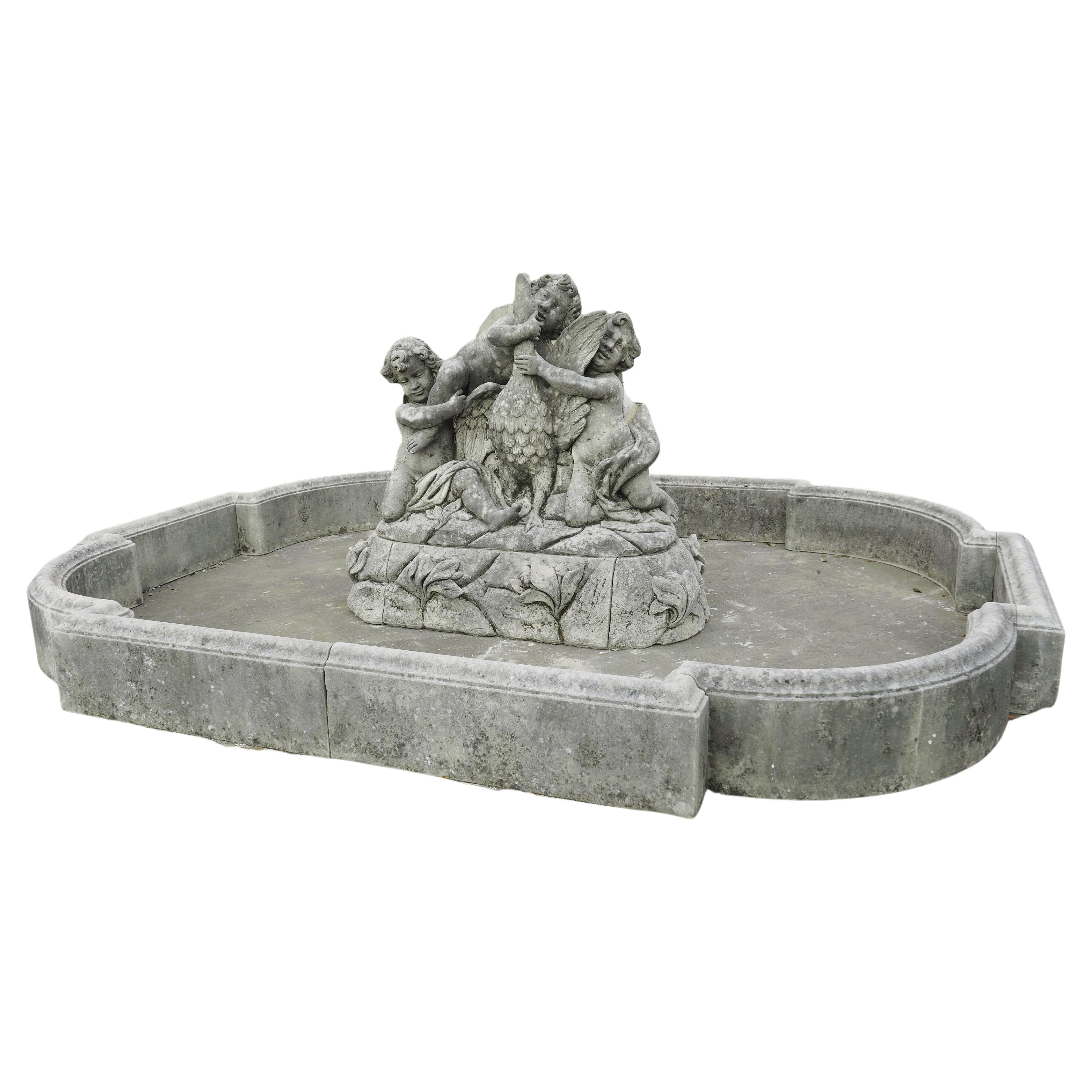 Grand Italian Limestone Center Fountain with Putti and Goose Water Feature For Sale