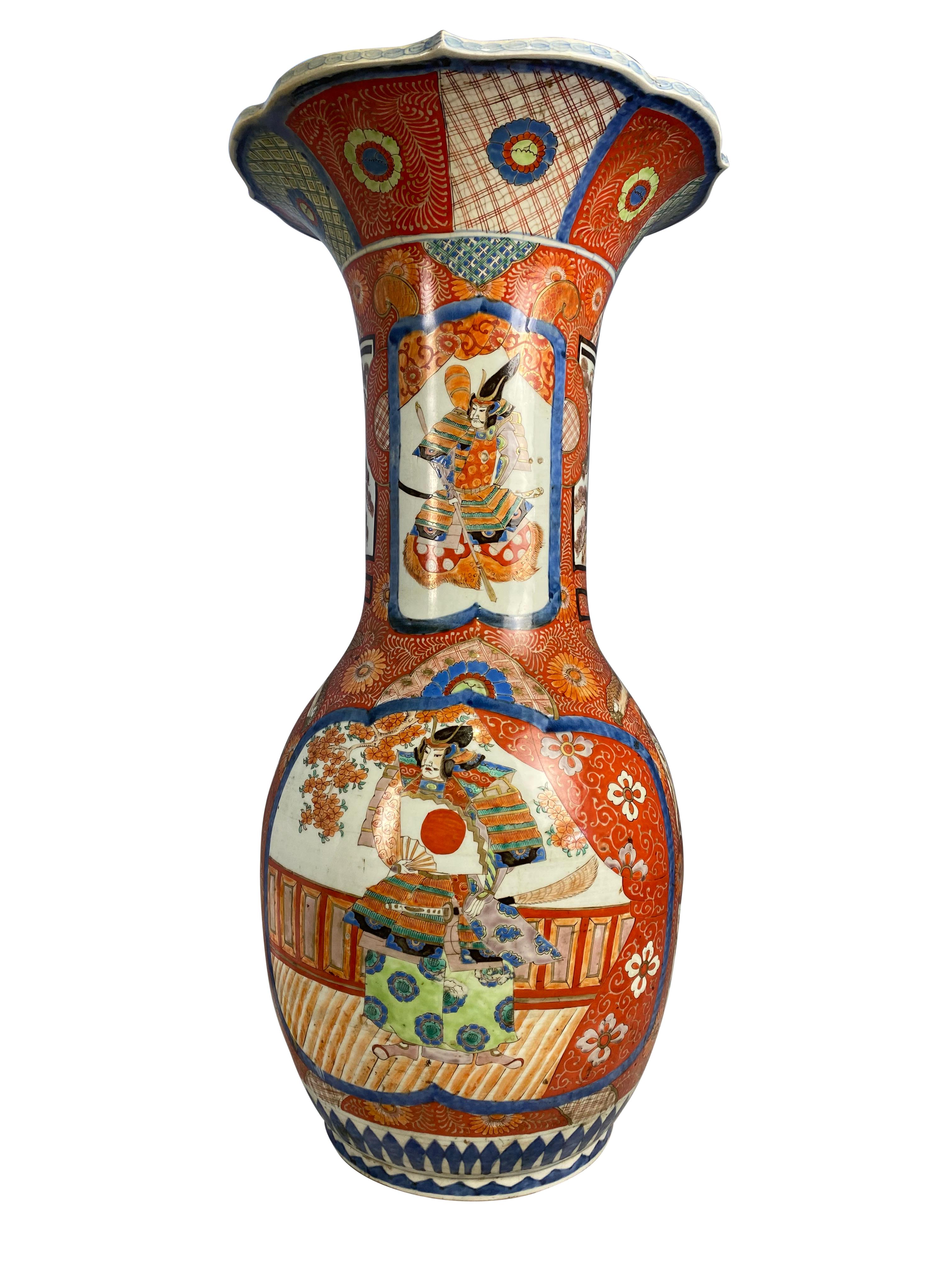 A grand Japanese porcelain Imari vase hand painted with classical scenes. Likely to have originated from Arita in Hizen Province, Japan. The body shape is elegantly designed to have a narrow middle and incredibly wide top.

Dimensions (cm)
80