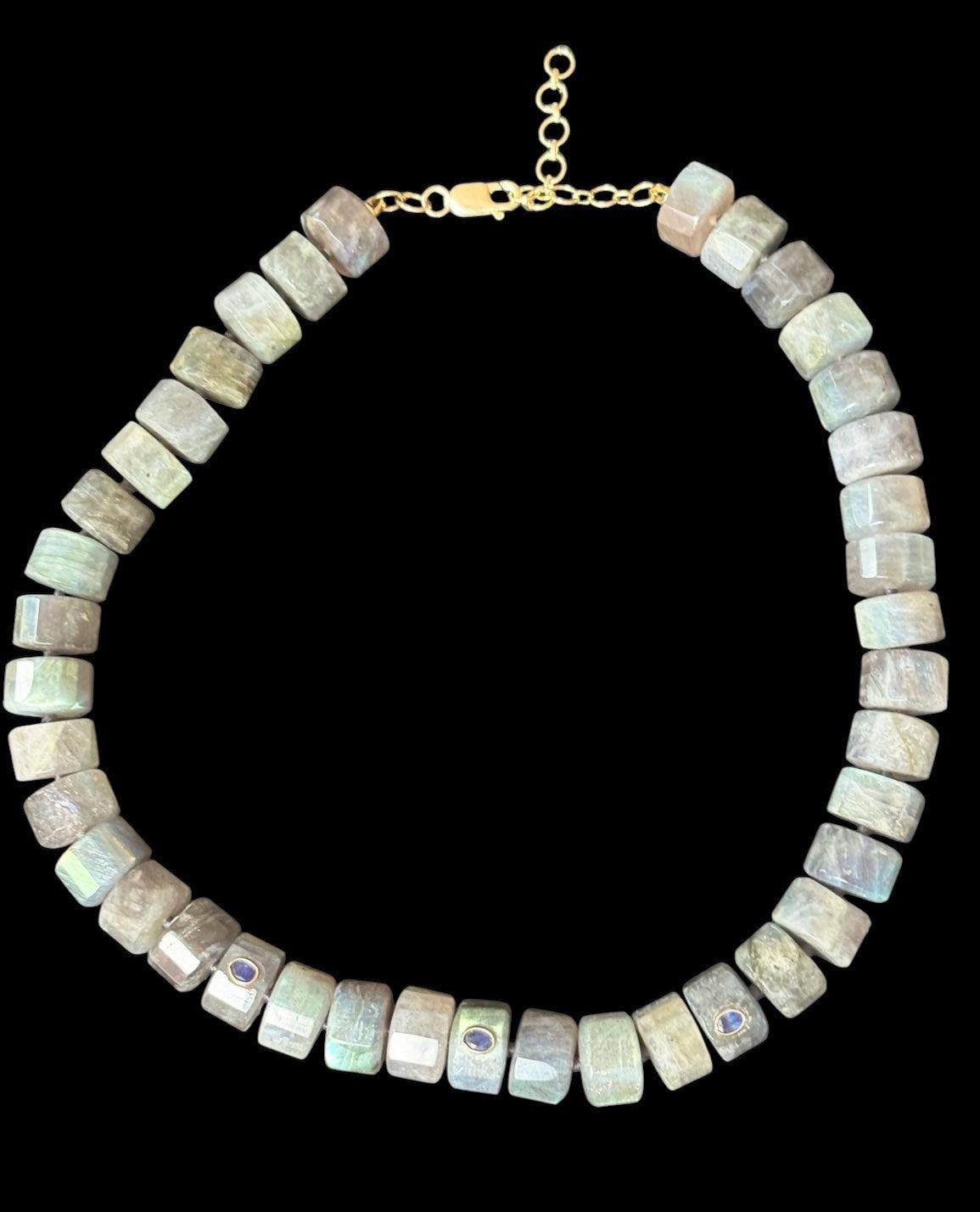 Grand Labradorite Necklace

Labradorite, Blue Sapphires, 14k Gold

This necklace can be worn as a choker at 14.25”, up to 16.25” with the 14k gold extender at the back.

The Labradorite beads are 10mm round. The weight of this necklace feels so good