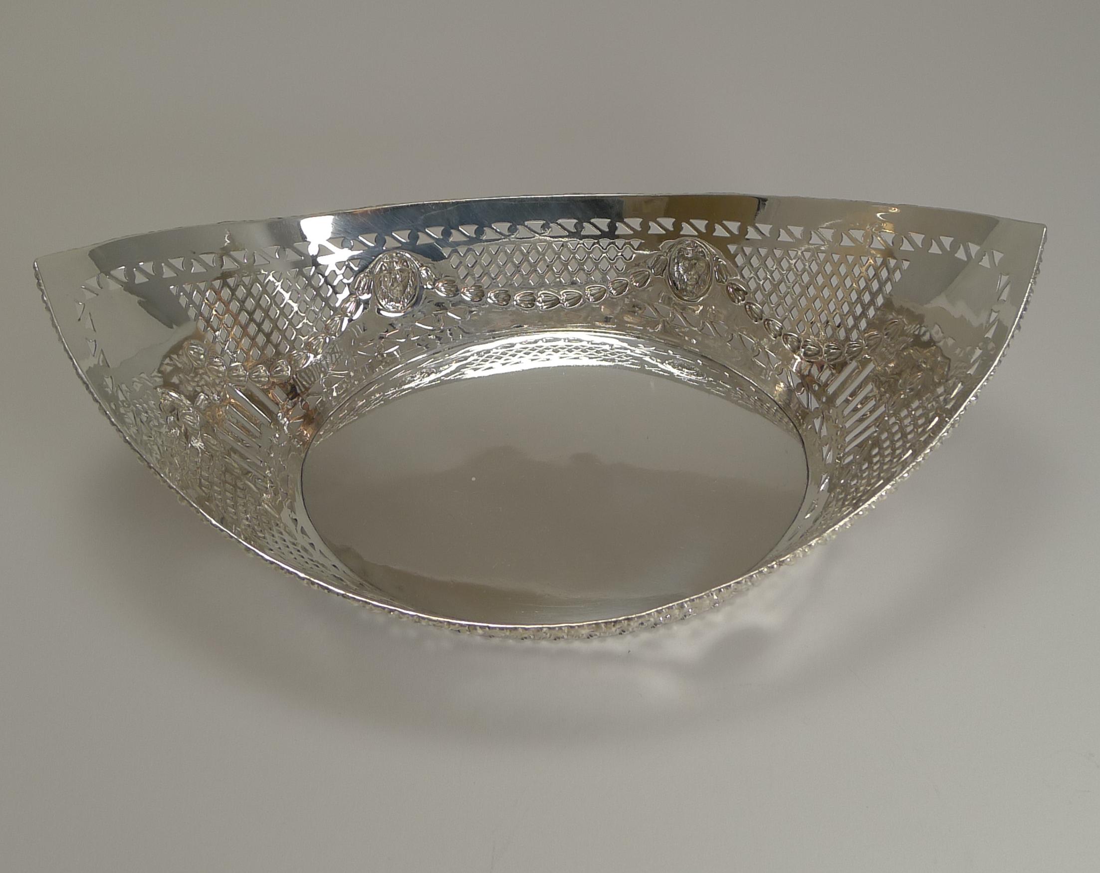 A grand and extremely handsome bread basket made from EPNS (Electro-Plated Nickel Silver) and dating to circa 1900.

The beautifully shaped basket is pierced or reticulated with a raised border to the rim and foot and a continuous repousse foliate