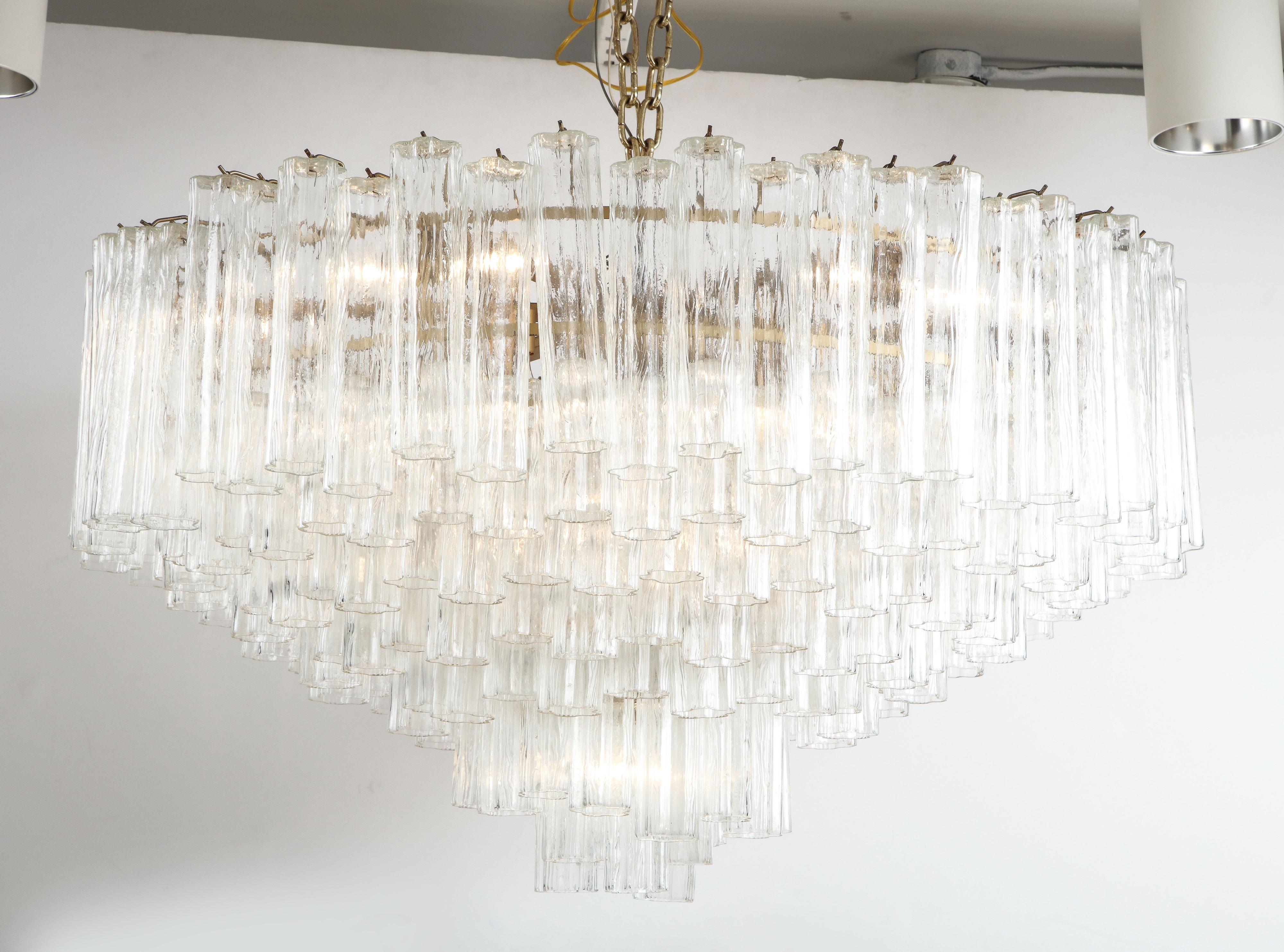 A large scale 4 foot wide tiered Murano tube glass chandelier with a matte gold frame. 21 standard sockets with 1500 watt capacity. Rewired . Frame can painted white or silver at no additional cost. Can be a flush mounted or on a chain. All glass is