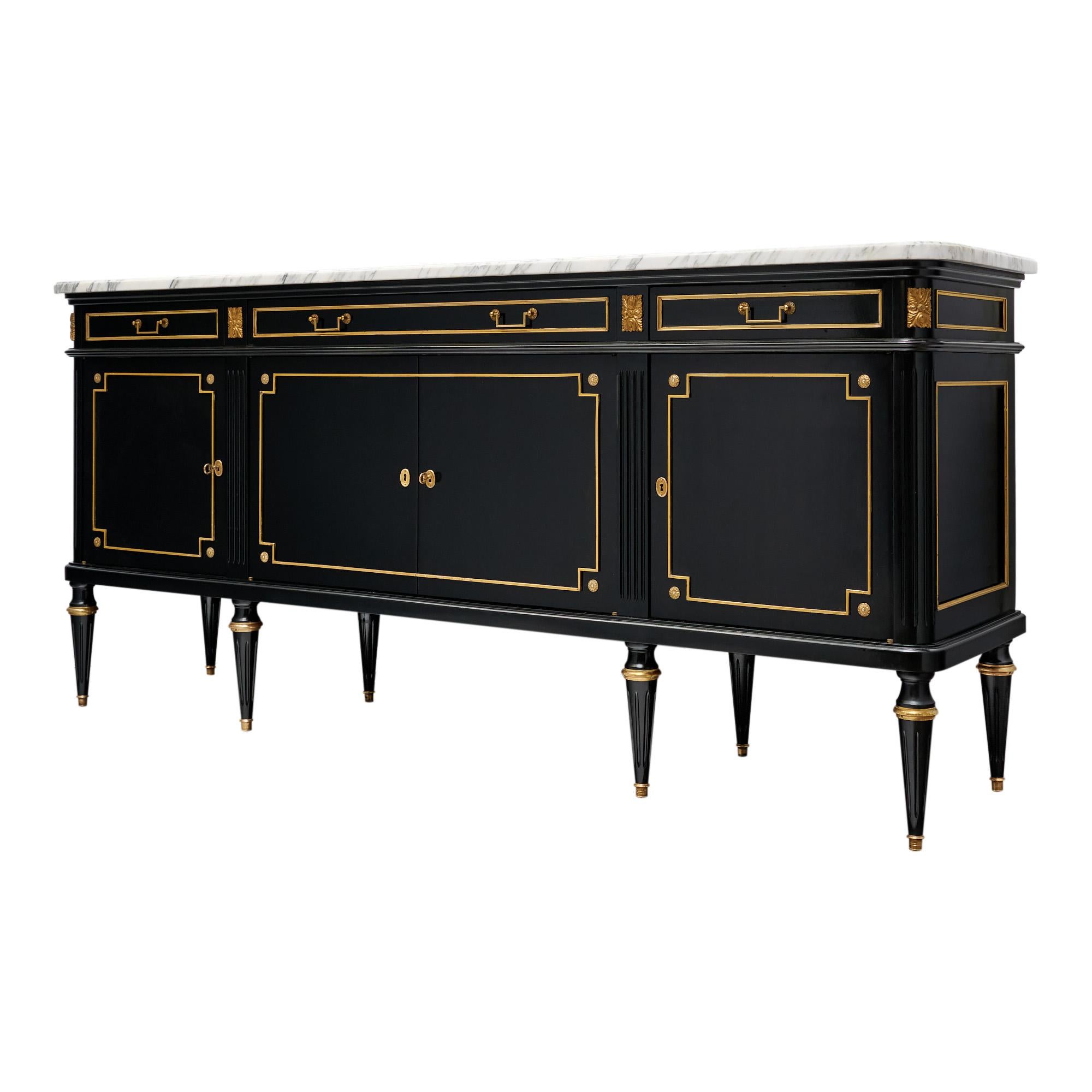 Buffet from France in the Louis XVI style. This enfilade is made of mahogany that has been ebonized and finished with a lustrous French polish of museum-quality. There are four doors that open to interior shelving. In the upper traverse there are