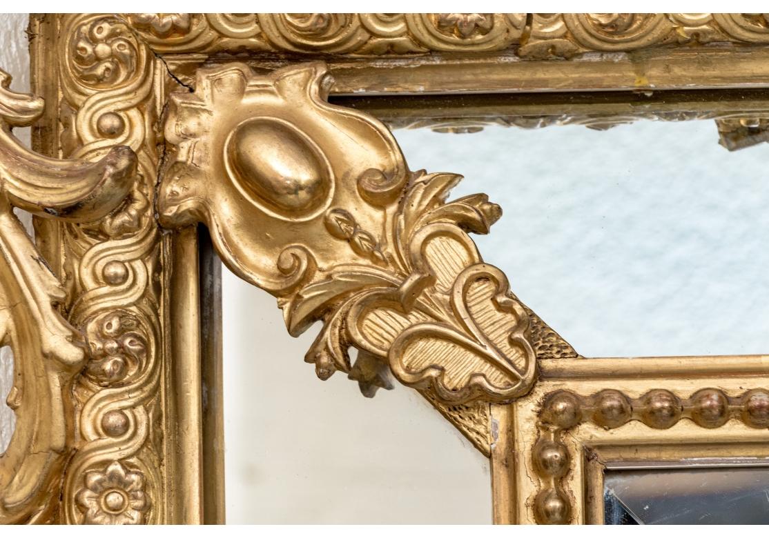Carved Grand Louis XVI Style Segmented Giltwood Mirror For Sale