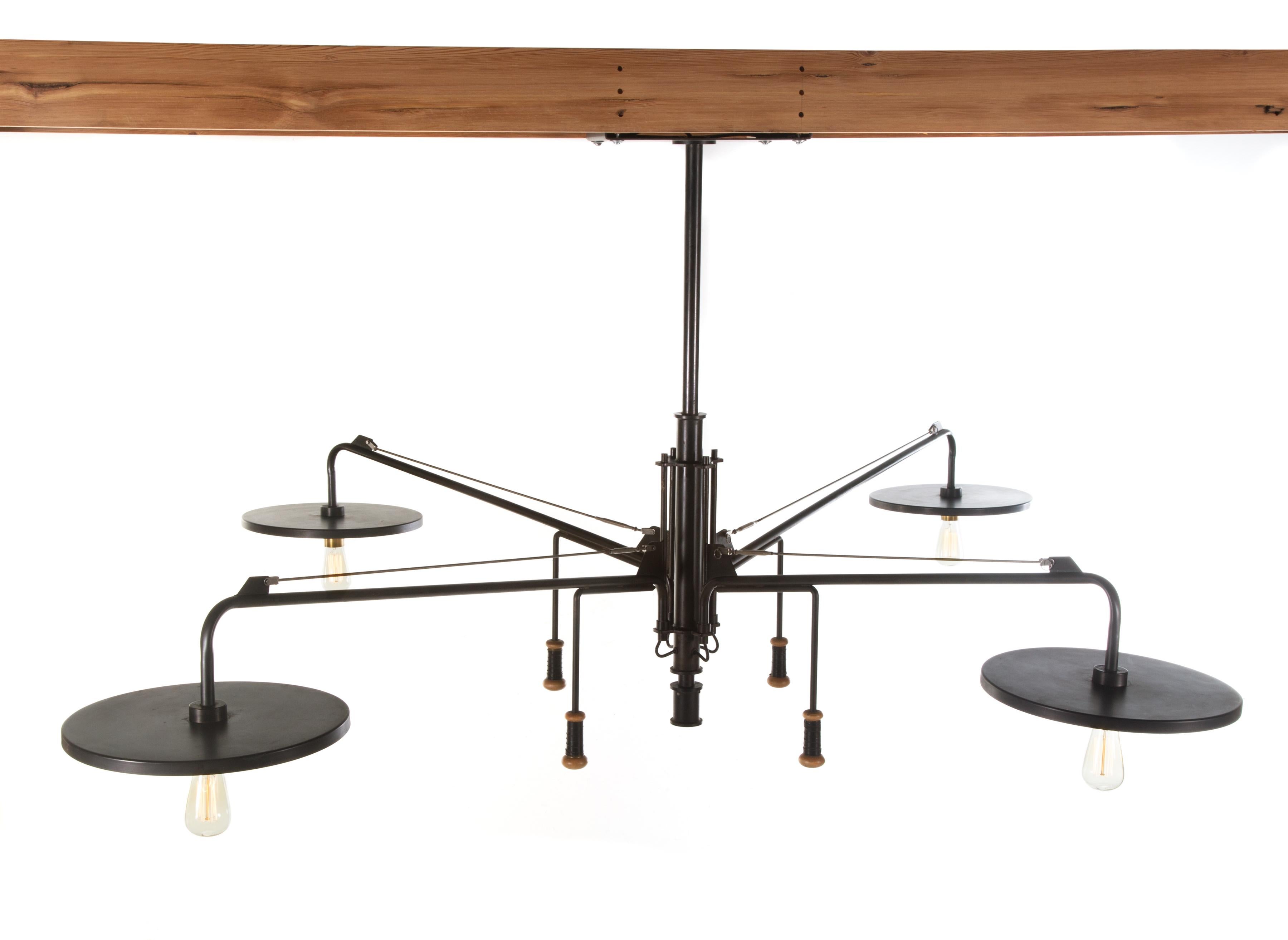 Impressively scaled and adjustable, 4-arm ceiling fixture by Luminaire, circa 1985. Unusual form is probably custom. The arms and fixture body are made of wrought steel with spun brass light diffusers and leather-wrapped, turned maple arm-adjustment