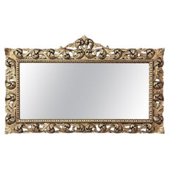 Grand miroir baroque italien du milieu du siècle en bois doré percé