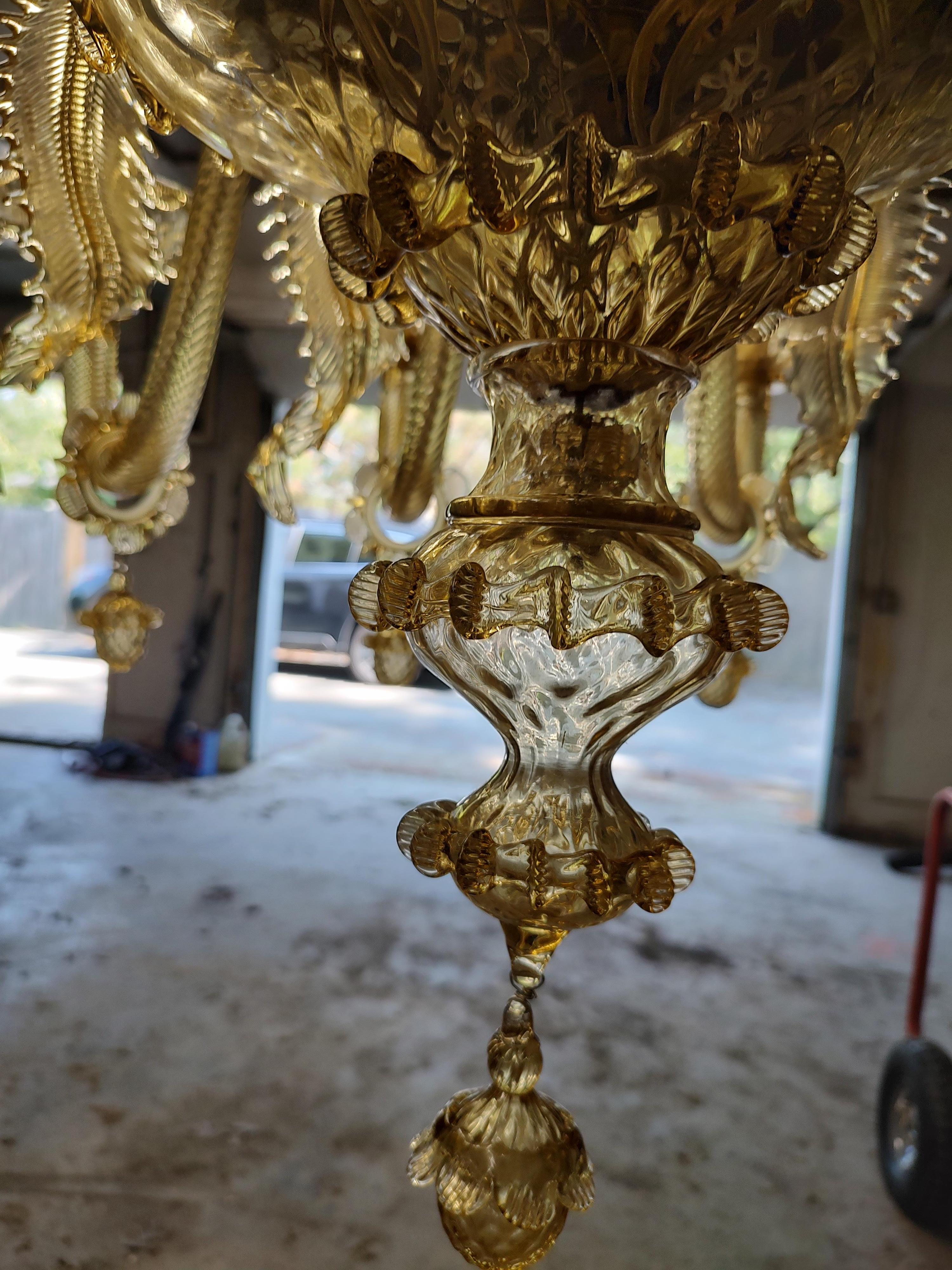 Fabulous and totally Grand, twelve arm Venetian Chandelier from the island of Murano. New wiring and UL listed ready to be hung. No damage or missing pieces, no replacement pieces either. All original. Spectacular glass floral pieces in the center