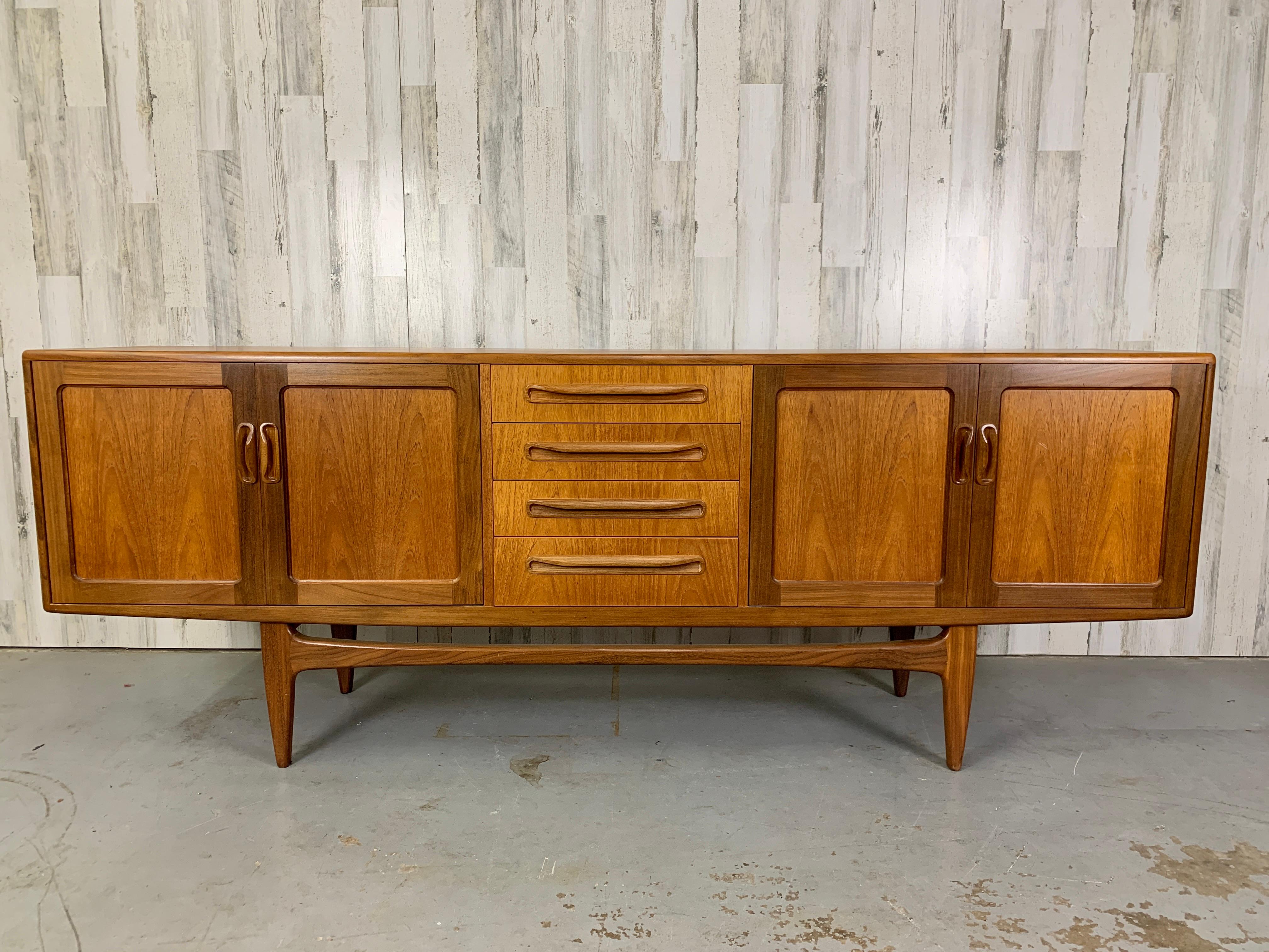 7 foot long teak credenza designed by IB Kofod-Larsen for G plan. In very good original condition with dovetailed drawers and adjustable shelves.