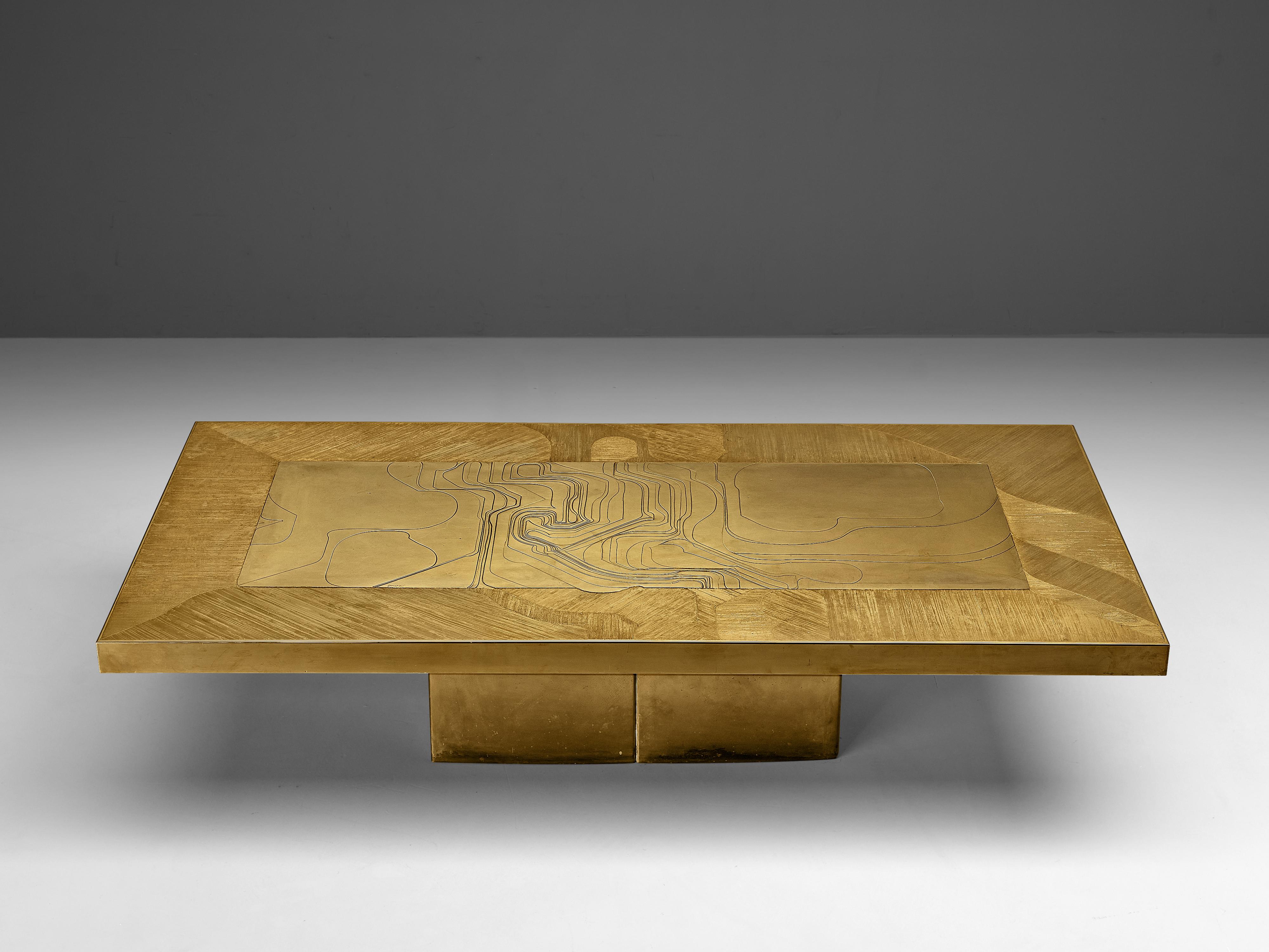 Nadie Jenatzy, coffee table, etched brass, Belgium, circa 1980

This refined brass coffee table is on the edge between sculpture and functional table. The rectangular top with vividly etched lines seems to float above the base. A frame of closely