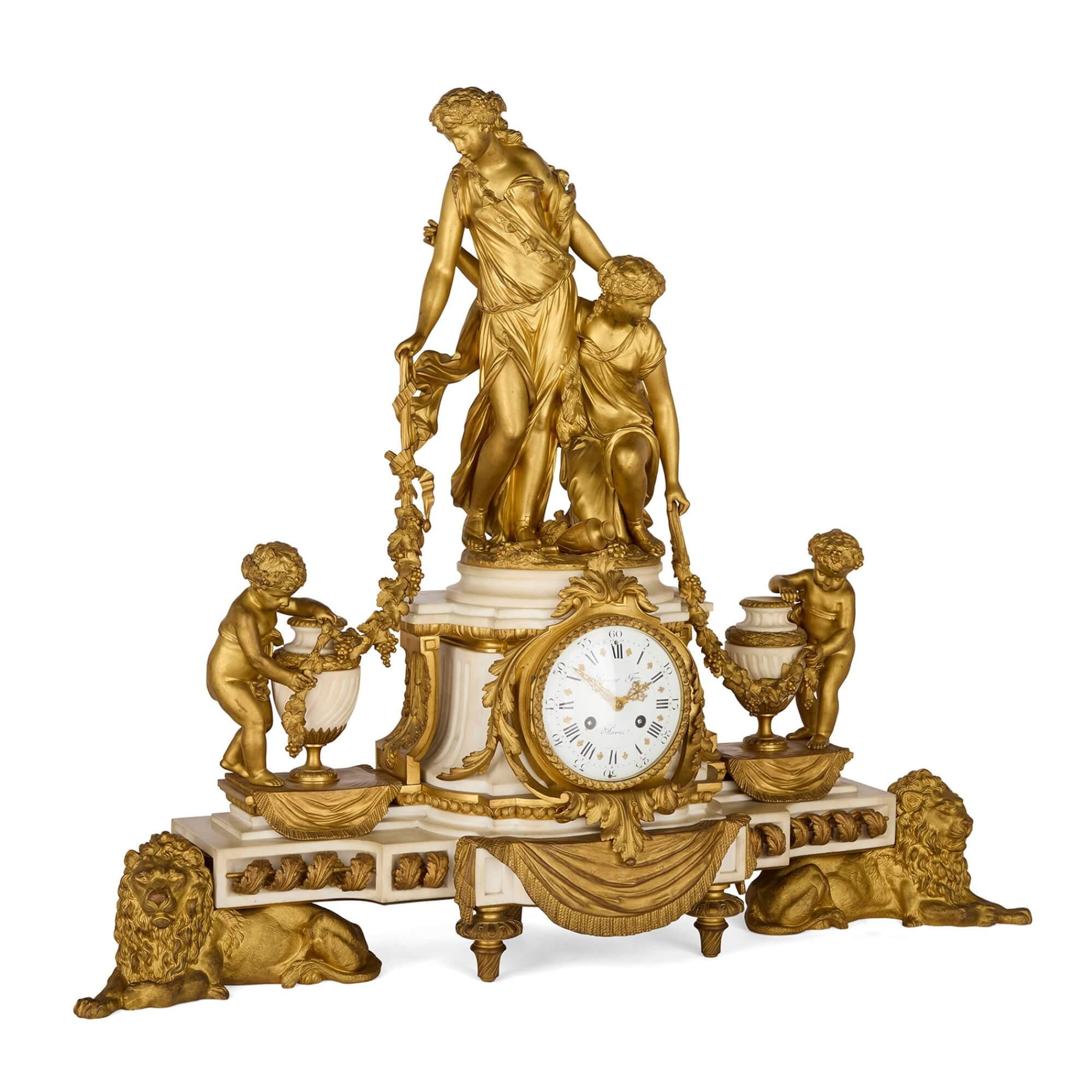 Grand ormolu and marble clock set by Raingo Frères and Salmson
French, Late 19th Century 
Clock: Height 69cm, width 81cm, depth 23cm
Candelabra: Height 80cm, width 34cm, depth 34cm

This elegant clock set was created by Raingo Frères and Jean Jules