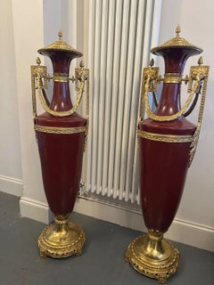 Grand Pair of French Empire Style Burgundy Porcelain & Gilt Bronze Covered Urns