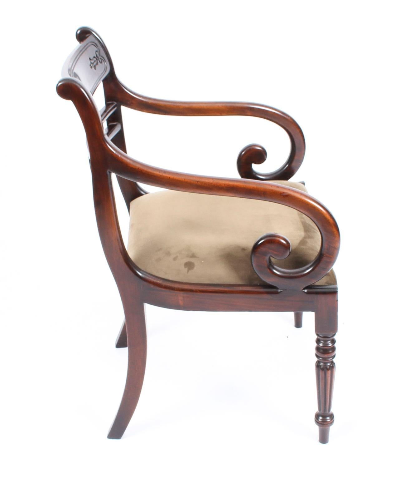 An absolutely fantastic English made pair of Regency style armchairs, dating from the last quarter of the 20th century.

These chairs have been masterfully crafted in beautiful solid flame mahogany throughout and the finish and attention to detail