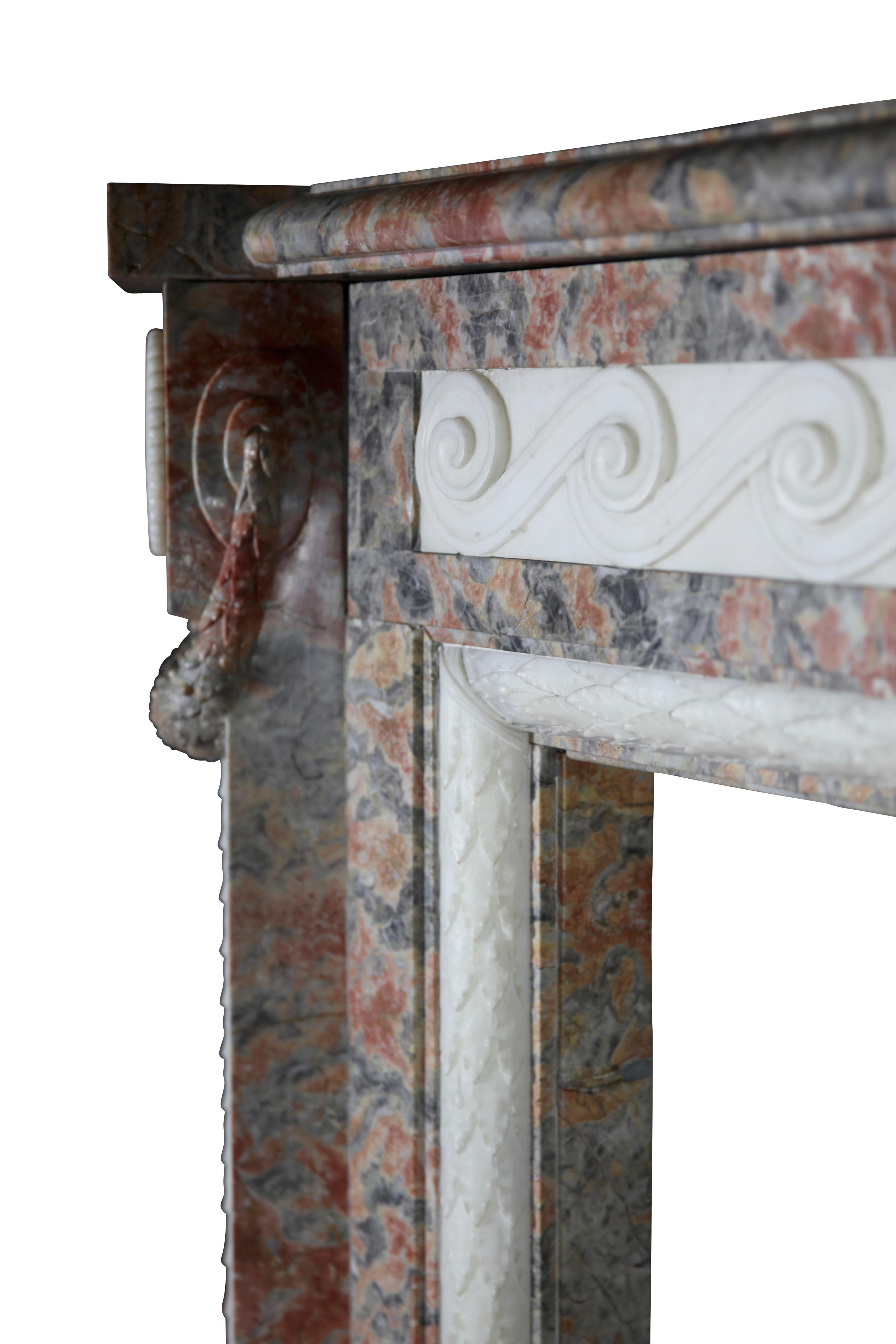 A state of the art original antique fireplace surround in Rouge Languedoc and white statuary marble inlay. It was built in a Louis XVI period palace. Reclaimed in Belgium. This chimney piece has exceptional proportions. 18th century.
Measures:
204