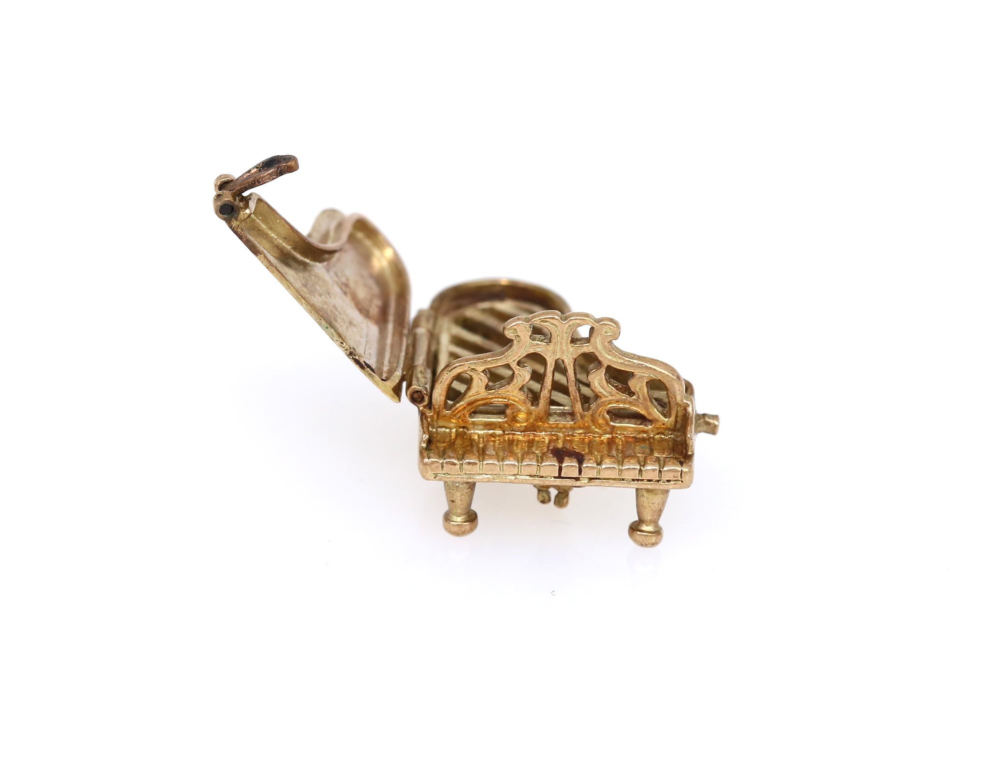 Victorian Grand Piano 9K Gold Charm for Charm Bracelet. British. 1900.
Charm bracelets have existed for a long time. Victorian 9K Gold items from England are most interesting, they are in its own league. First of all the details are great. Each item