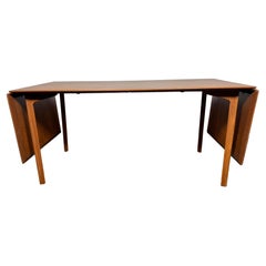 ‘GRAND PRIX’ - Extension dining table , teak & beech  by Arne Jacobsen