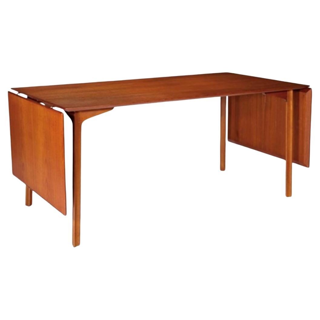 ‘GRAND PRIX’ - Extension dining table , teak & beech  by Arne Jacobsen